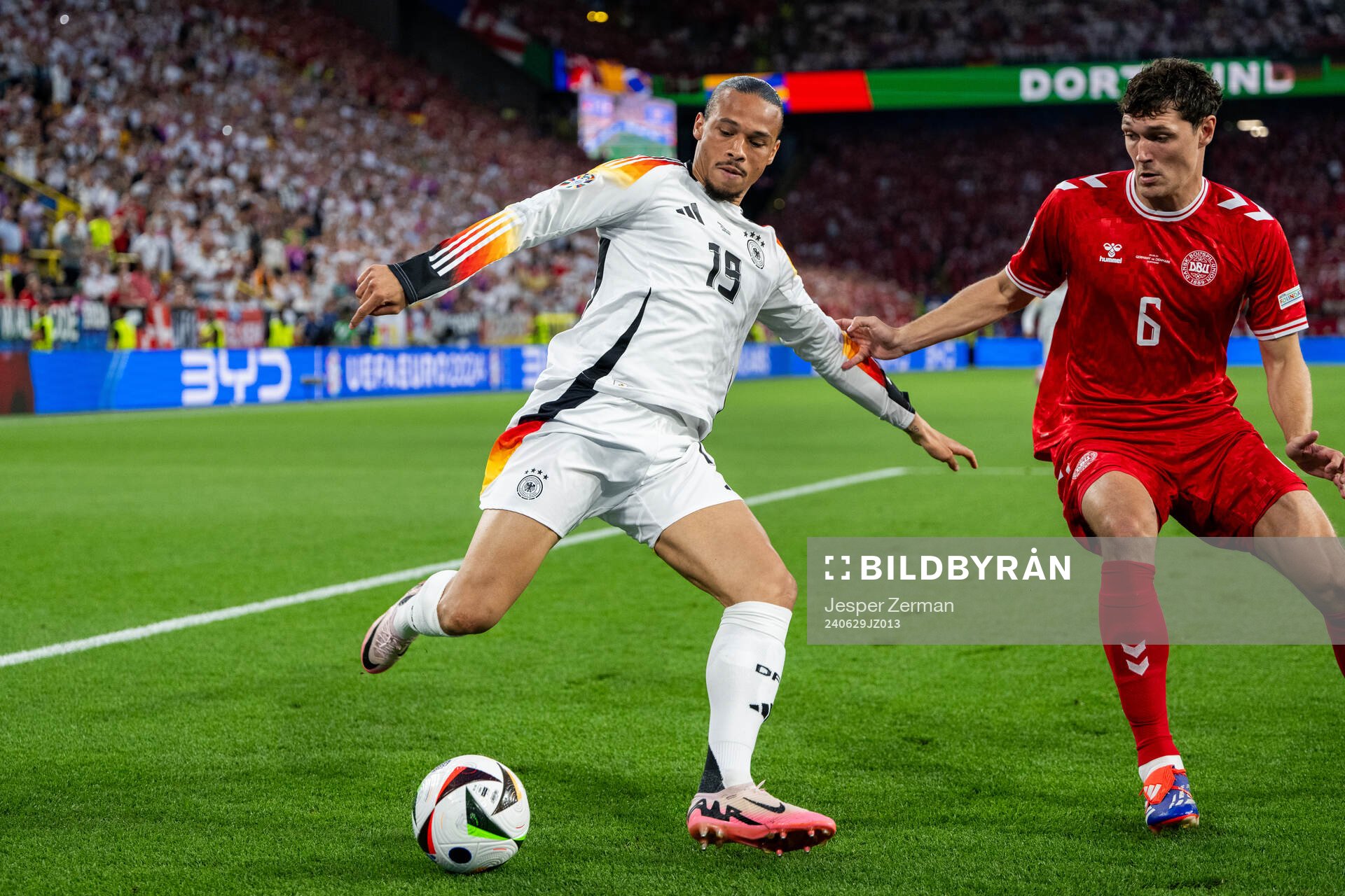 Leroy Sane of Germany and Andreas Christensen of Denmark