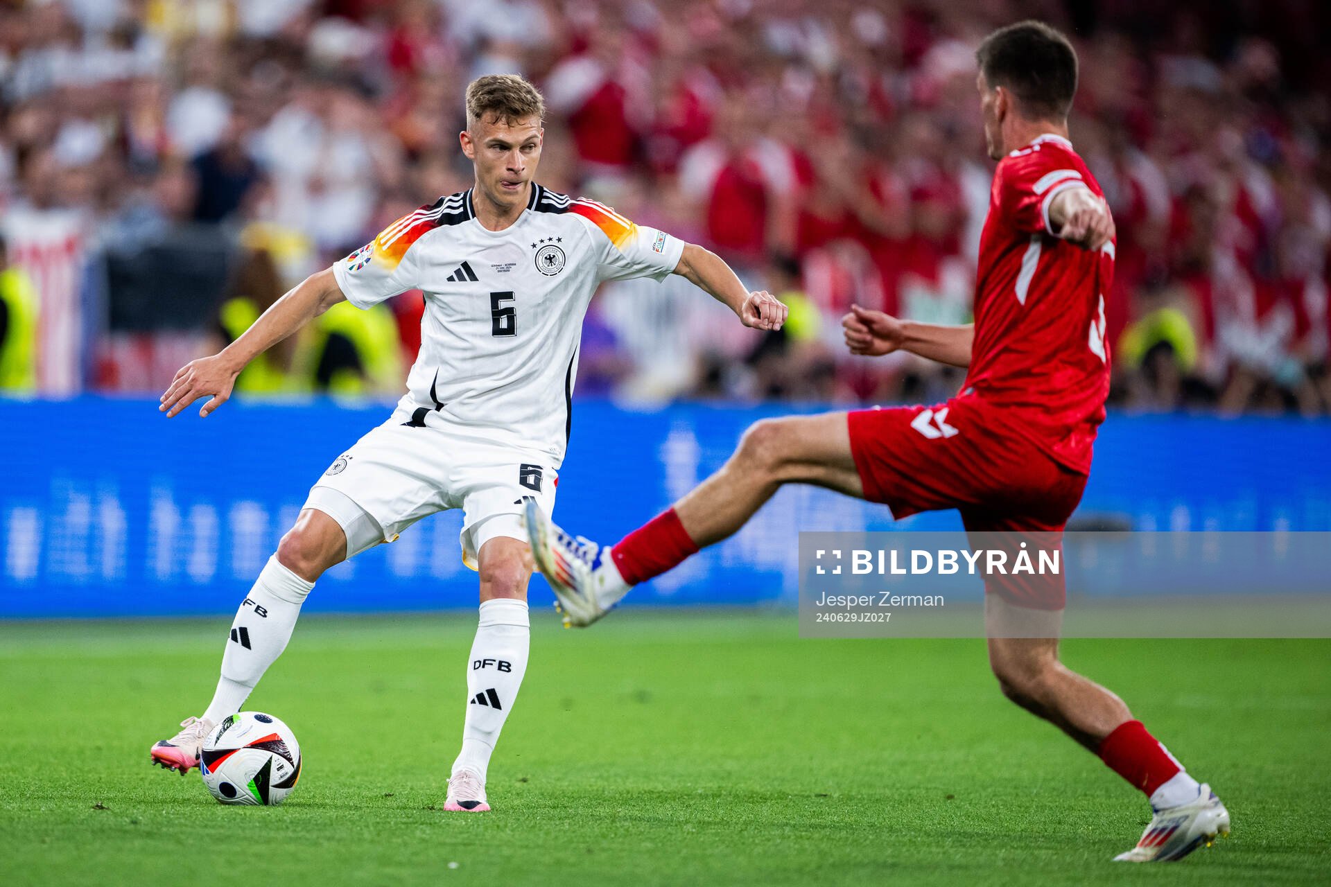 Joshua Kimmich of Germany and Joakim Mæhle of Denmark