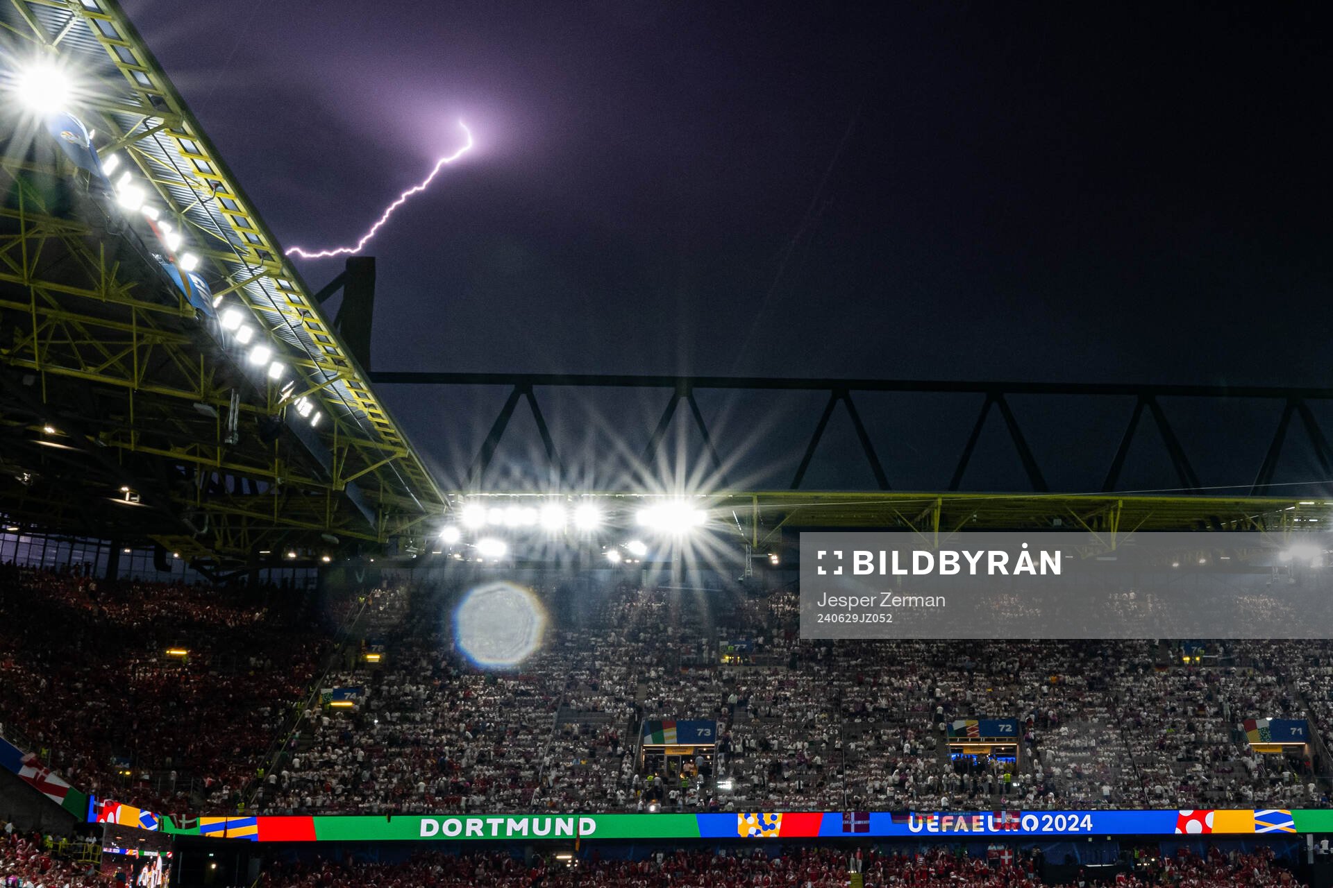 Lightning during the UEFA Euro 2024 Football Championship round of 16 match between Germany and Denmark on June 29, 2024 in Dortmund.