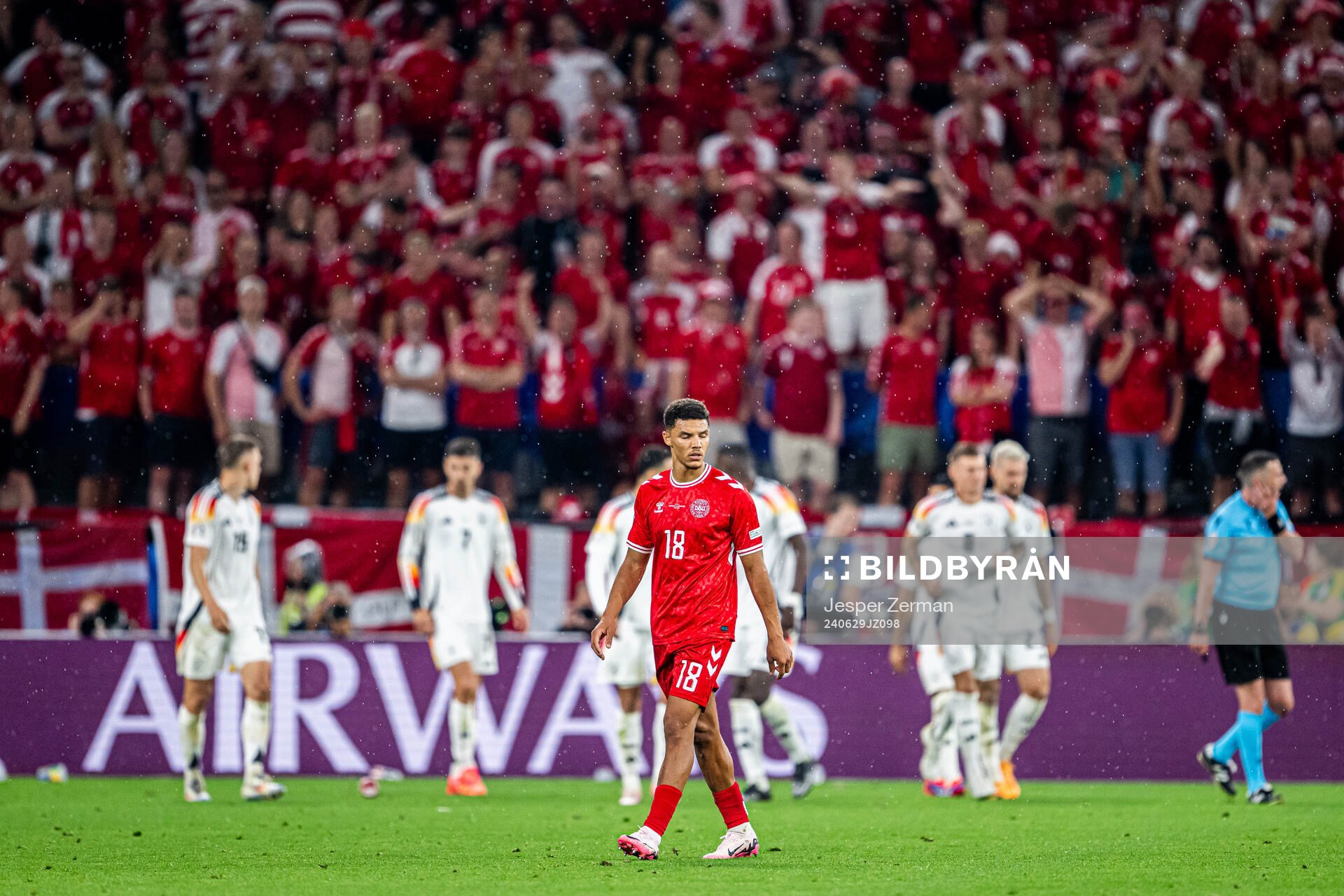 Alexander Bah of Denmark looks dejected