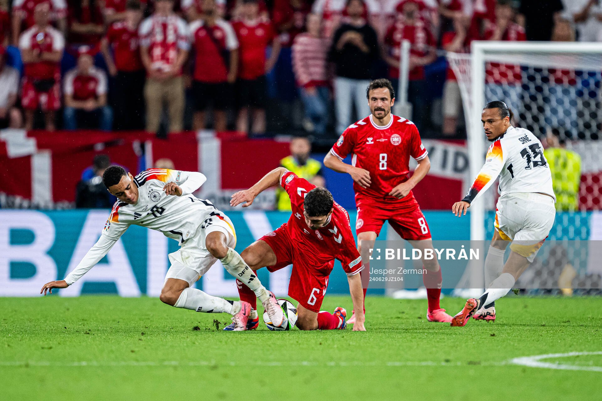 Jamal Musiala of Germany and Andreas Christensen of Denmark