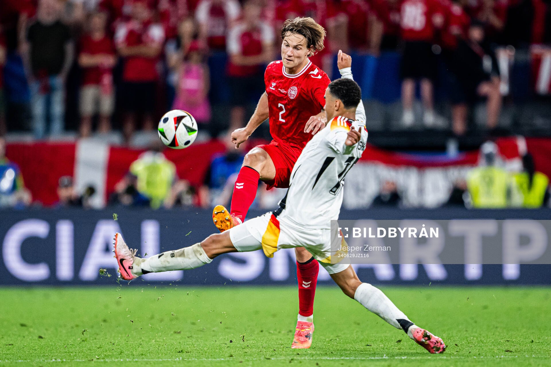 Joachim Andersen of Denmark and Jamal Musiala of Germany