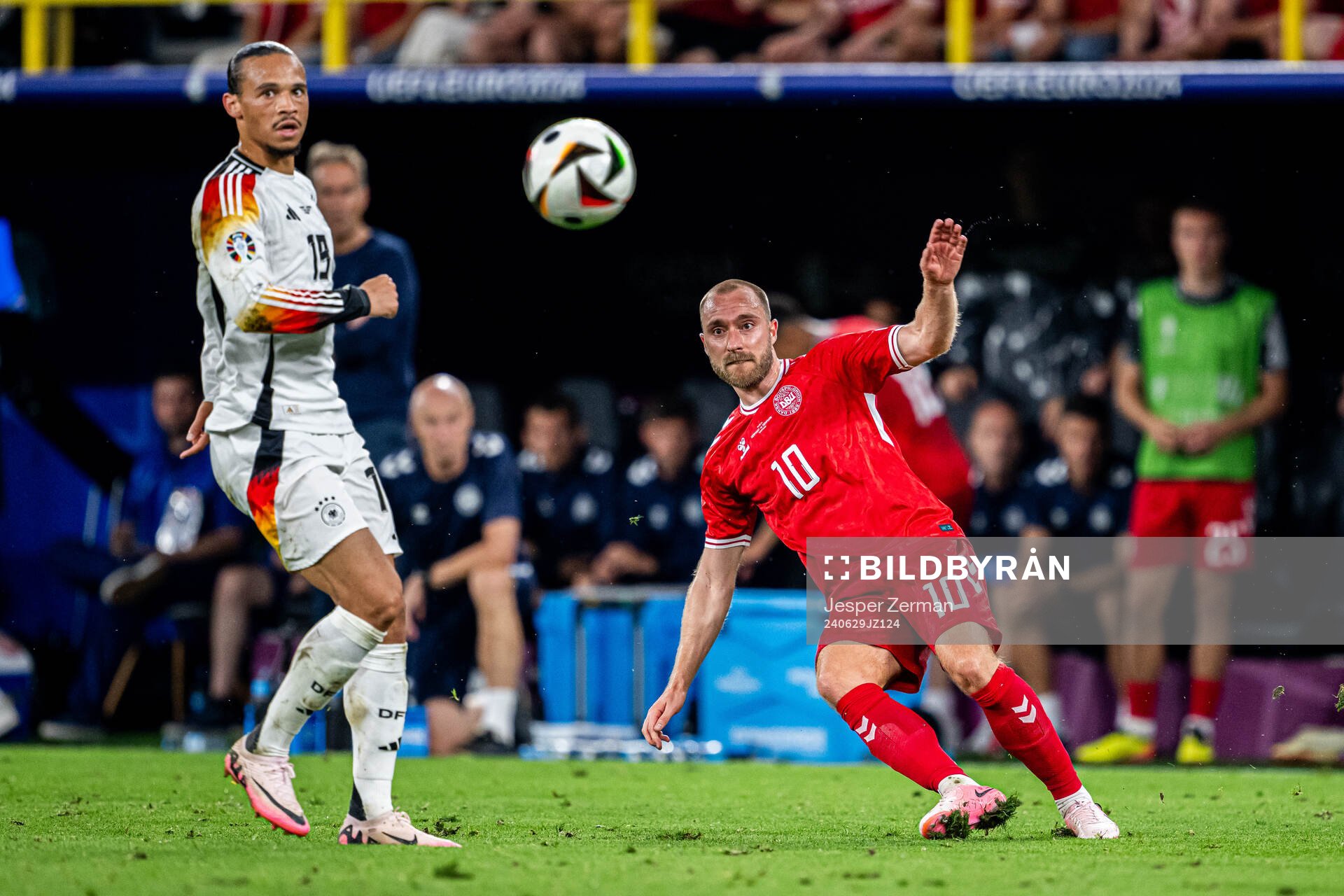 Leroy Sane of Germany and Christian Eriksen of Denmark