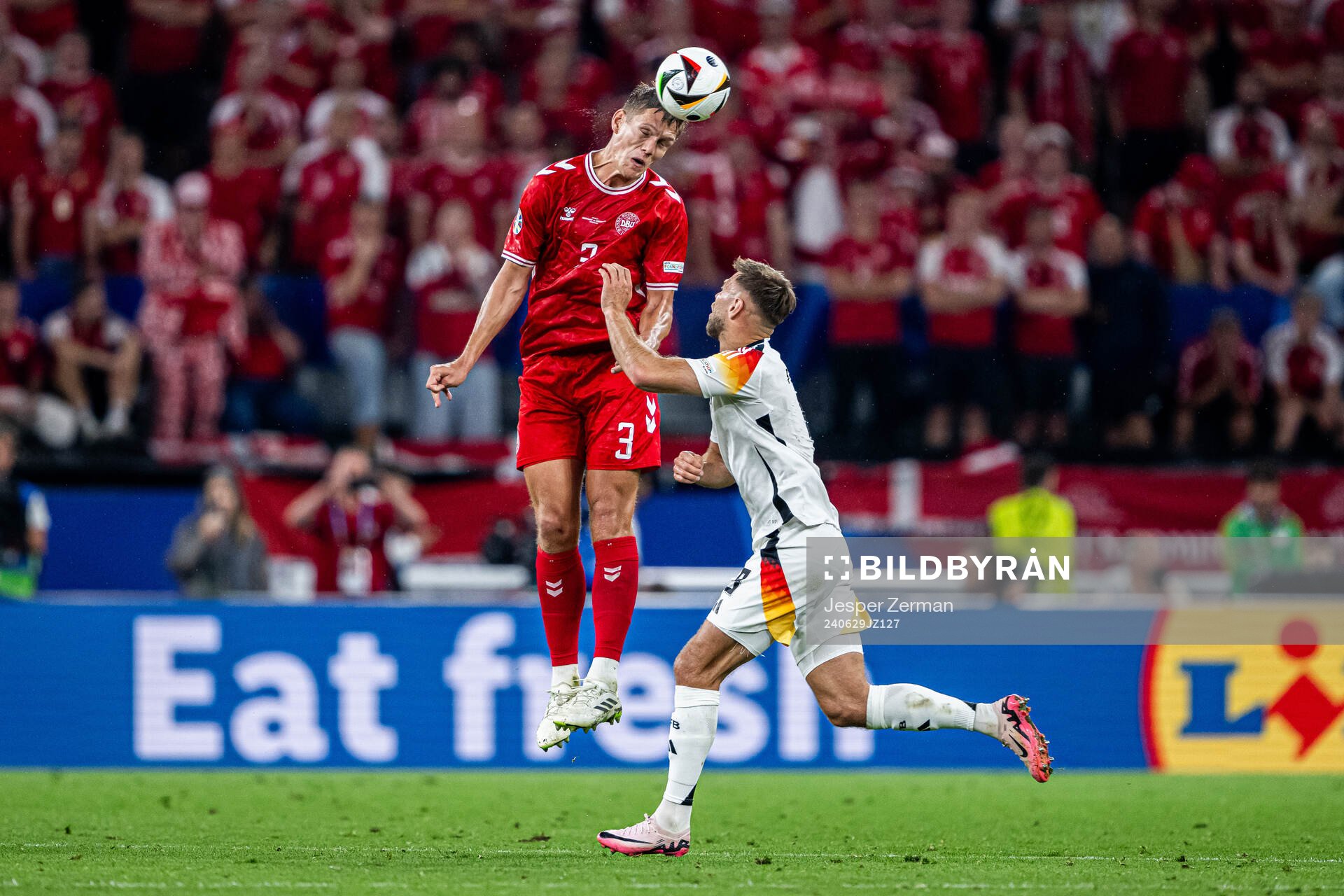 Jannik Vestergaard of Denmark and Niclas Fullkrug of Germany