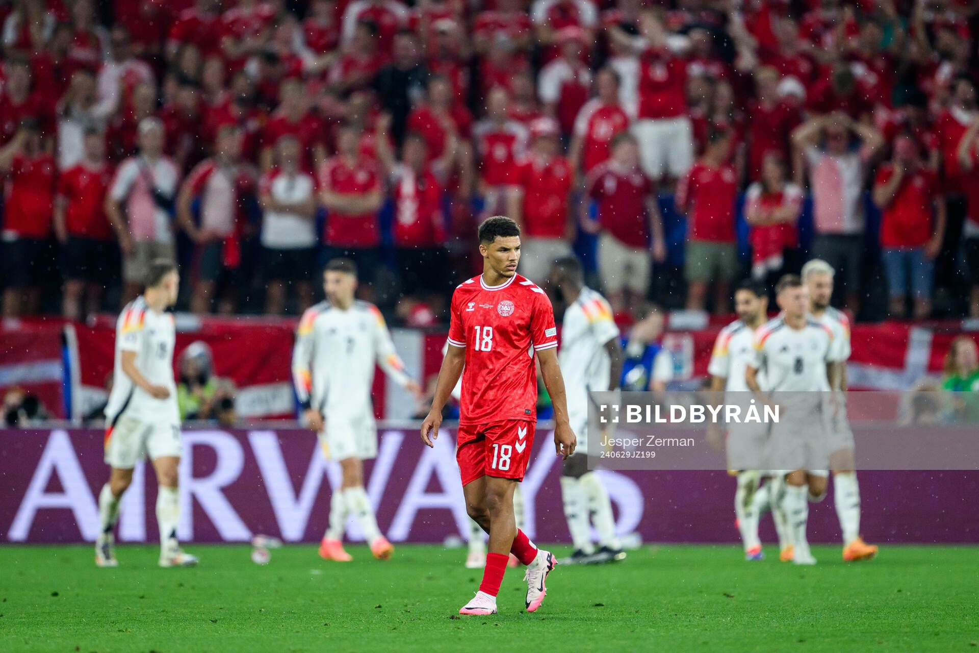 Alexander Bah of Denmark looks dejected
