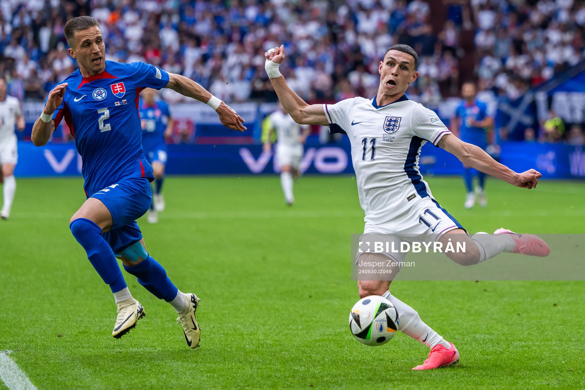 Peter Pekarik of Slovakia and Phil Foden of England