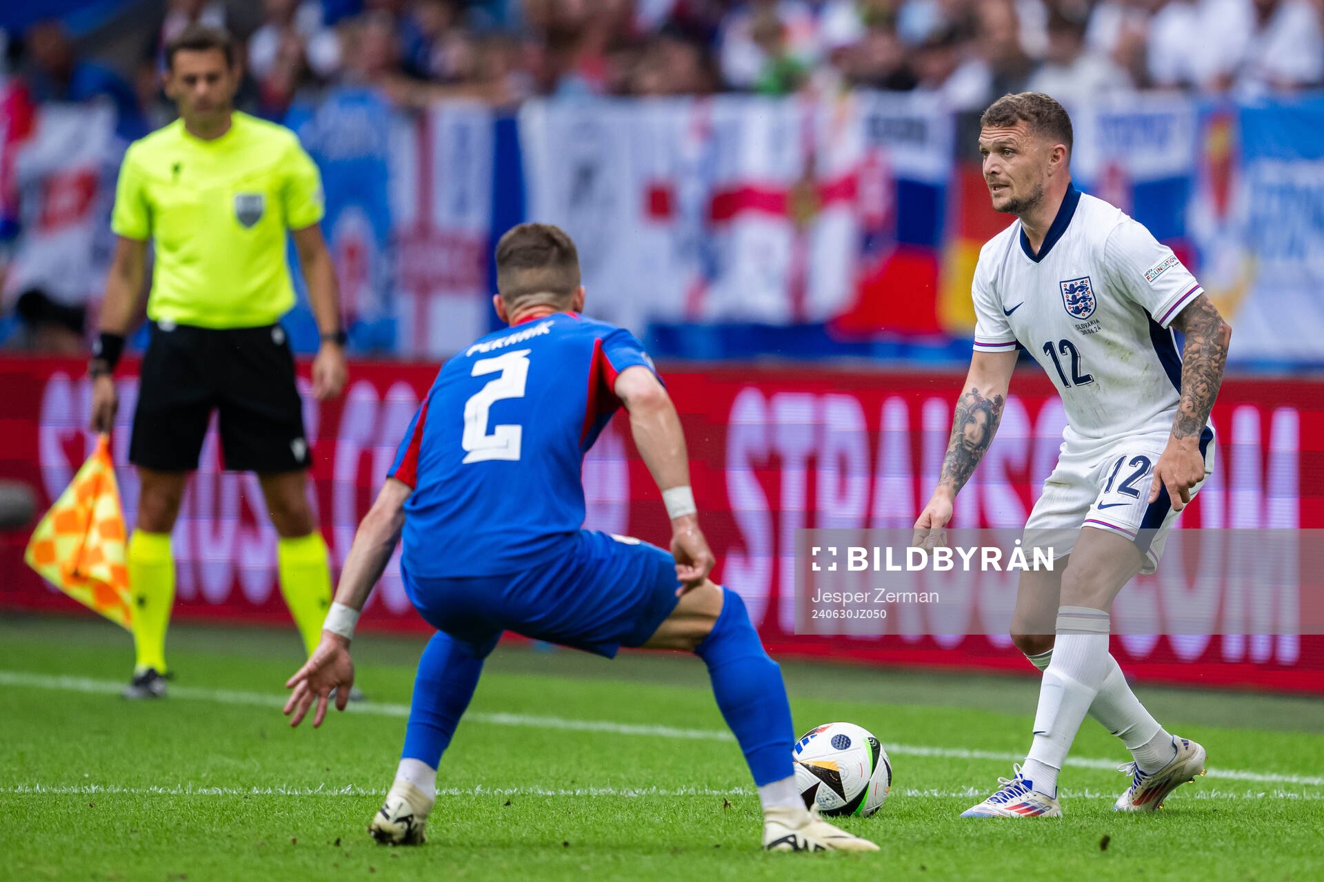 Peter Pekarik of Slovakia and Kieran Trippier of England