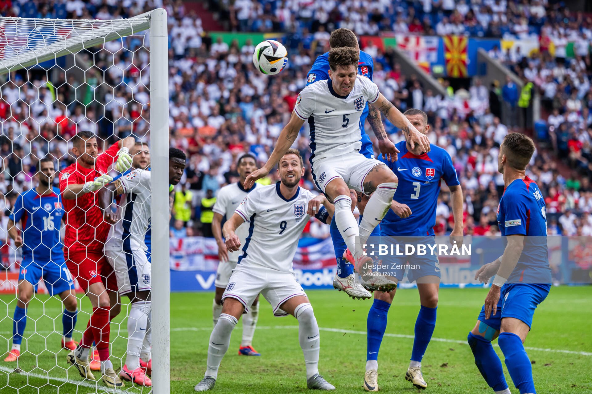 John Stones of England and Juraj Kucka of Slovakia