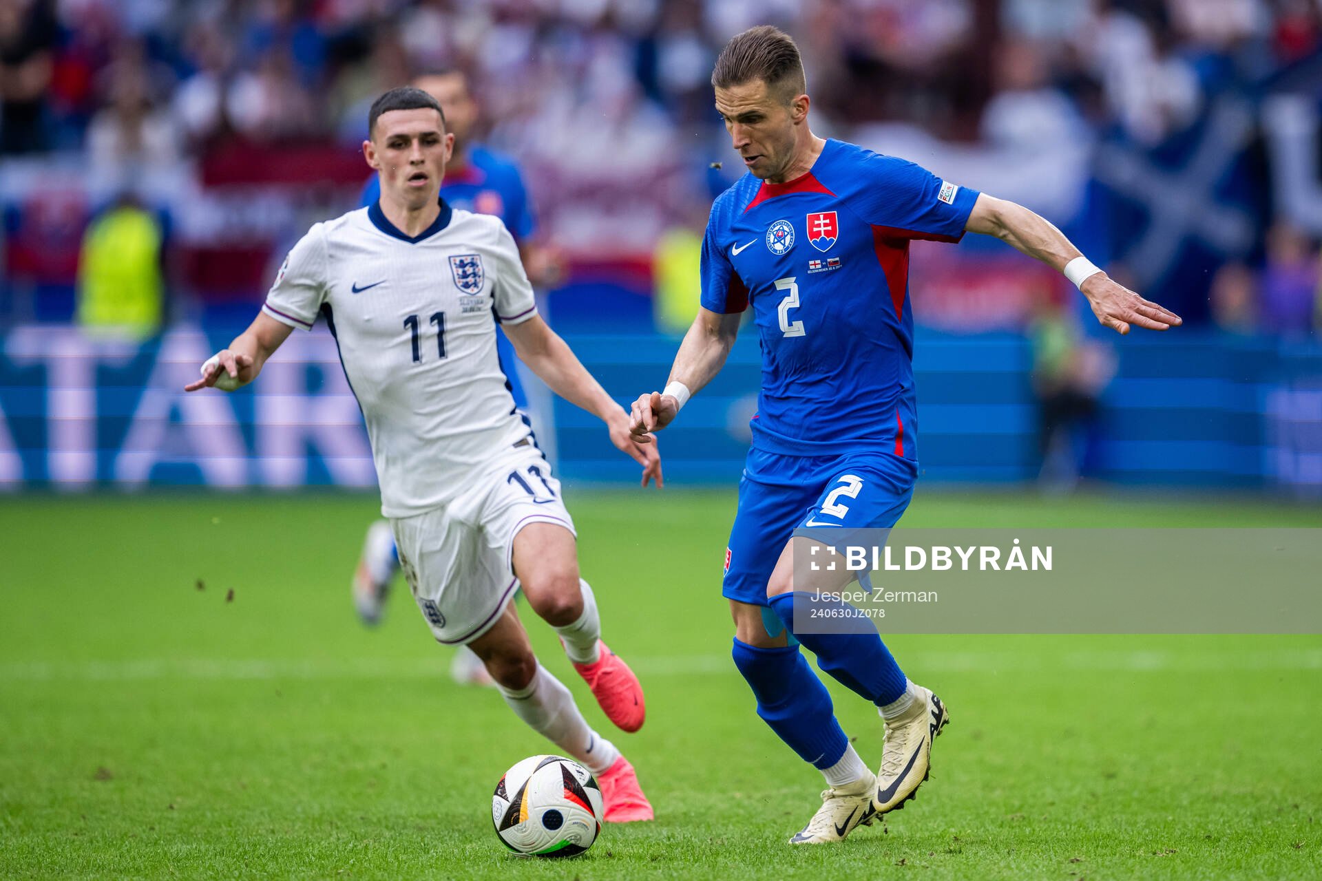 Phil Foden of England and Peter Pekarik of Slovakia