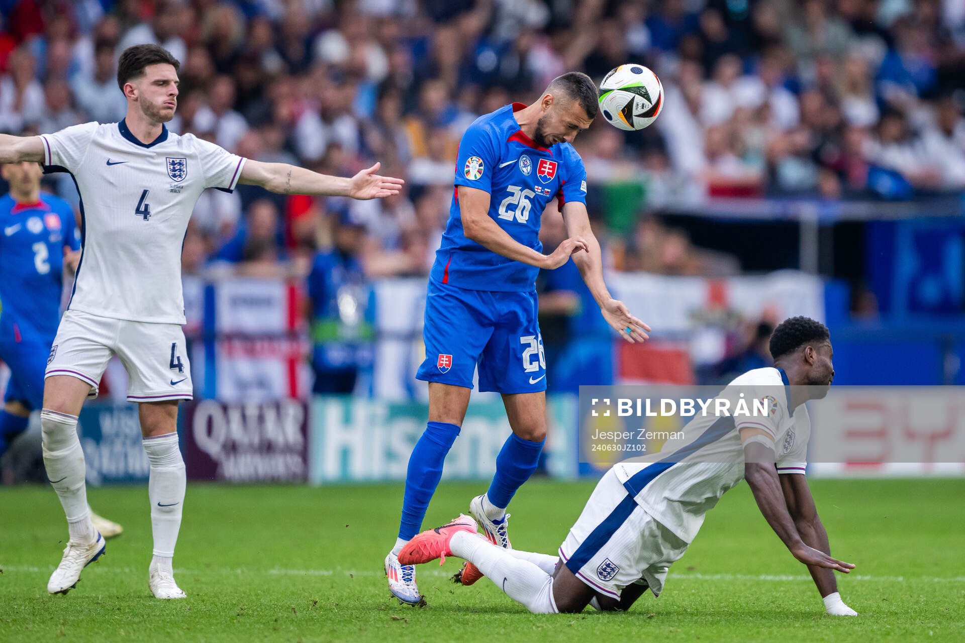 Ivan Schranz of Slovakia and Declan Rice and Marc Guehi of