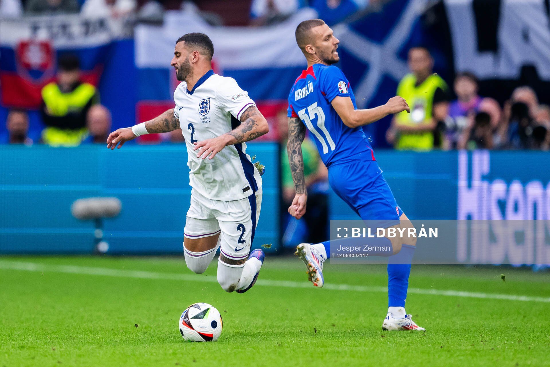 Kyle Walker of England and Lukas Haraslin of Slovakia