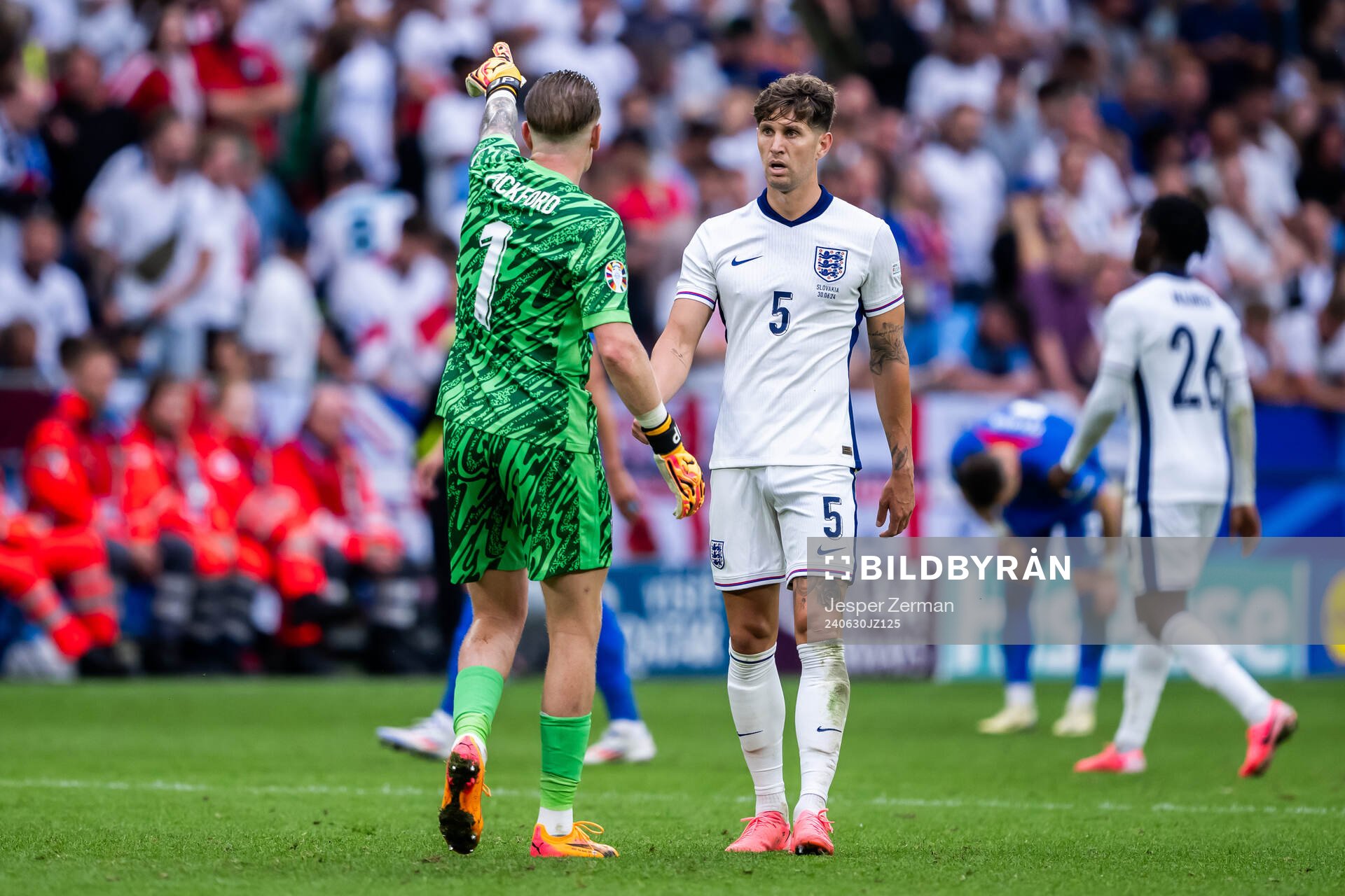 Goalkeeper Jordan Pickford and John Stones of England
