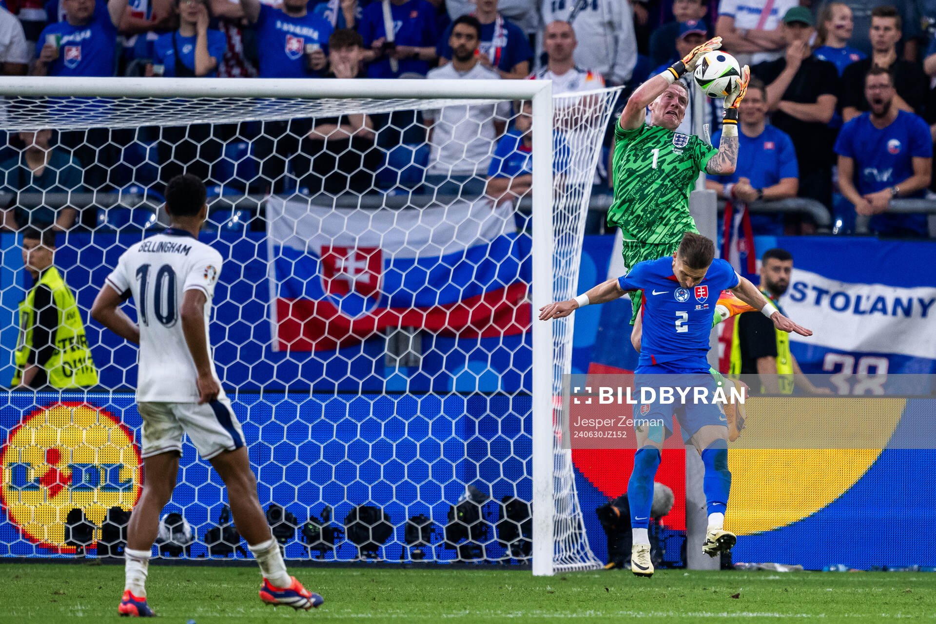 Peter Pekarik of Slovakia and goalkeeper Jordan Pickford of