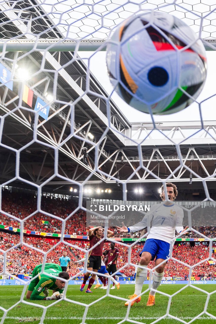 Goalkeeper Koen Casteels and Timothy Castagne of Belgium and Antoine Griezmann of France during the UEFA Euro 2024 Football Championship round of 16 match between France and Belgium on July 1, 2024 in Dusseldorf.