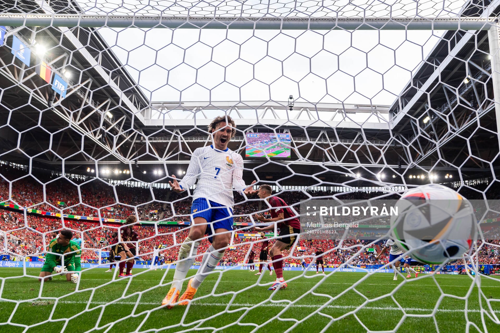 Antoine Griezmann of France and Jan Vertonghen of Belgium