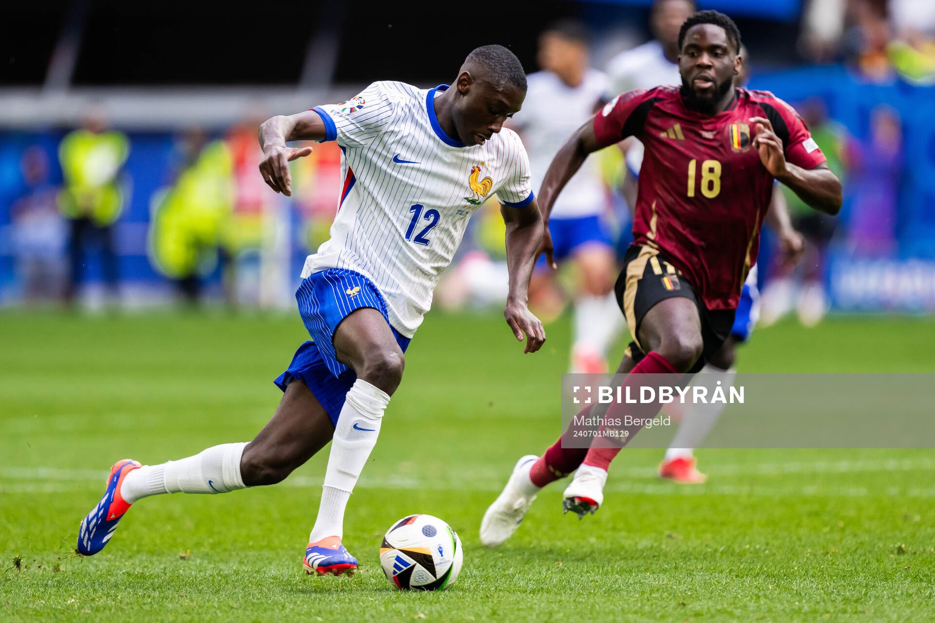 Randal Kolo Muani of France and Orel Mangala of Belgium