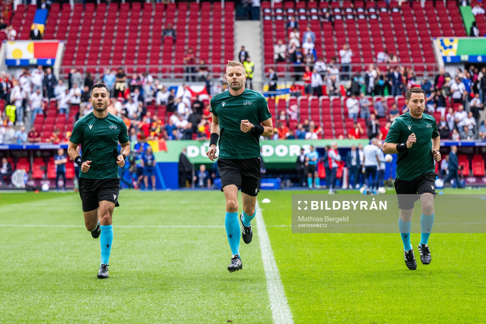 Assistant referee Mahbod Beigi, referee Glenn Nyberg and
