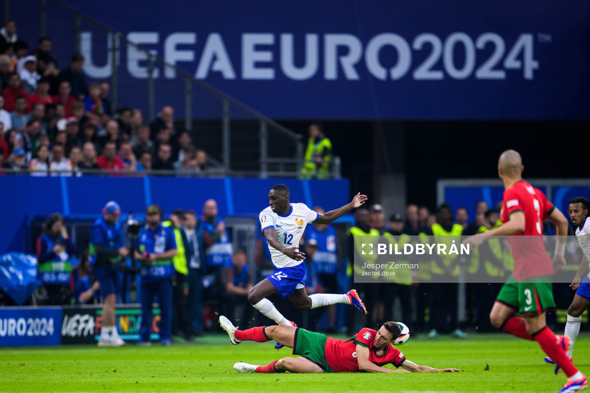 Randal Kolo Muani of France and Joao Palhinha of Portugal
