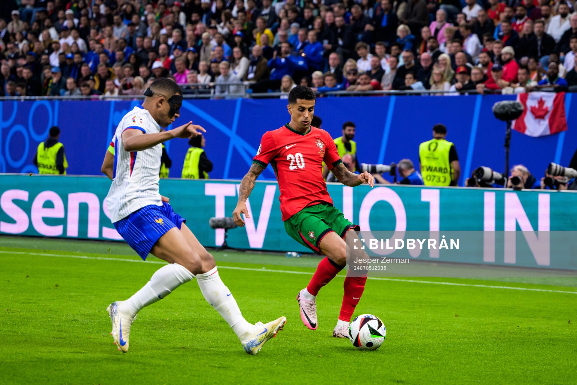 Kylian Mbappé of France and Joao Cancelo of Portugal