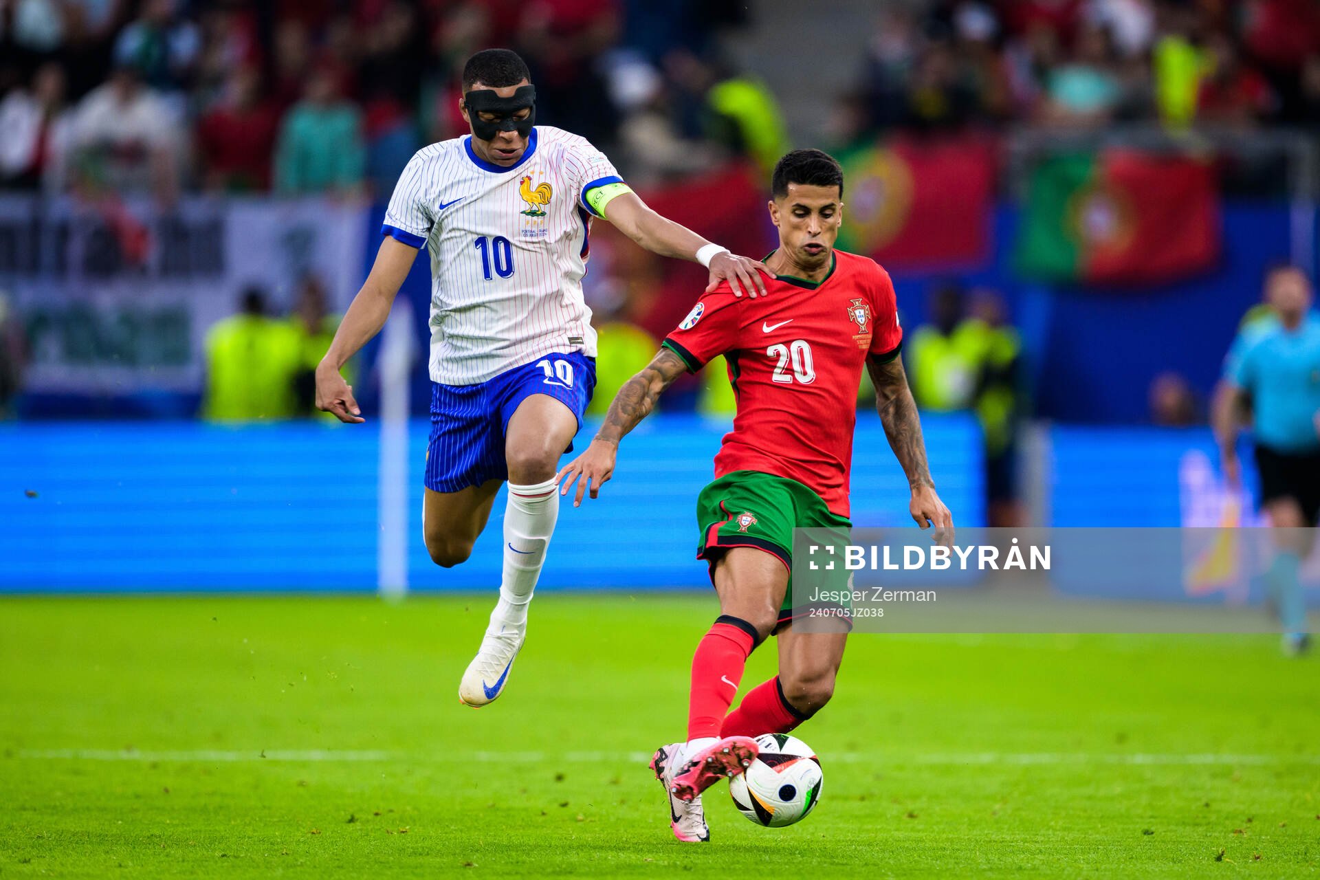 Kylian Mbappé of France and Joao Cancelo of Portugal