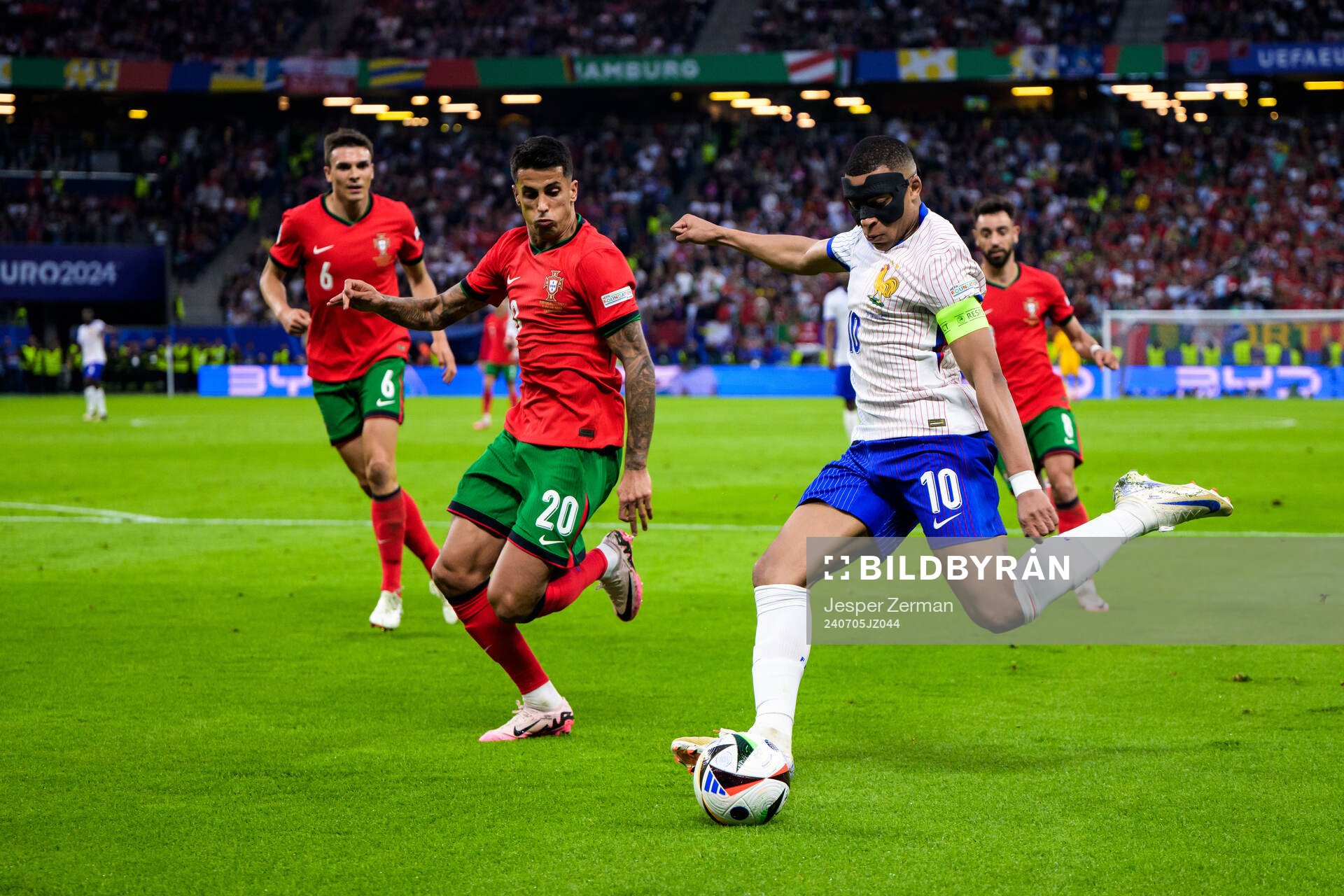 Joao Cancelo of Portugal and Kylian Mbappé of France
