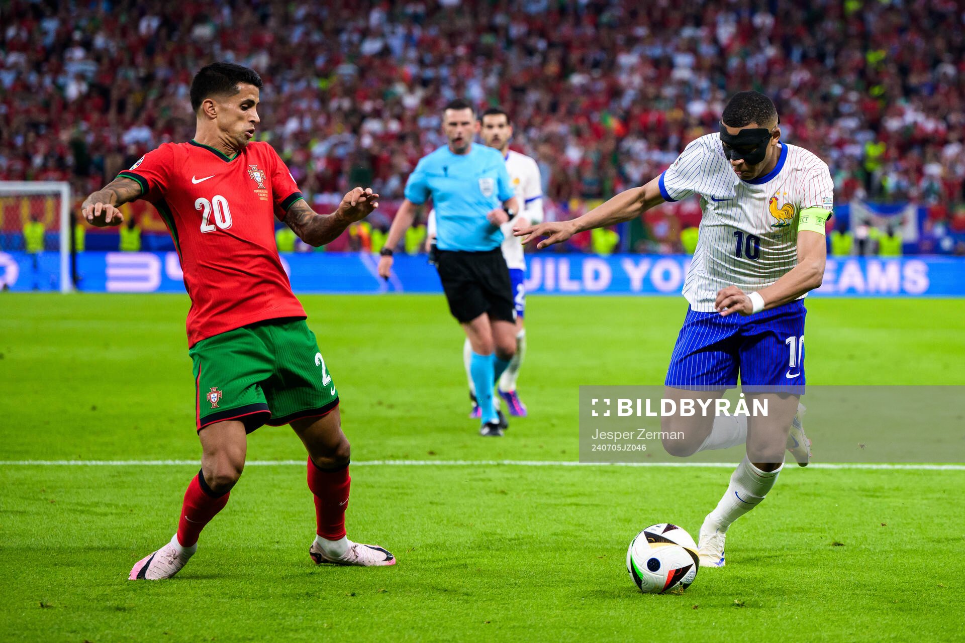 Joao Cancelo of Portugal and Kylian Mbappé of France