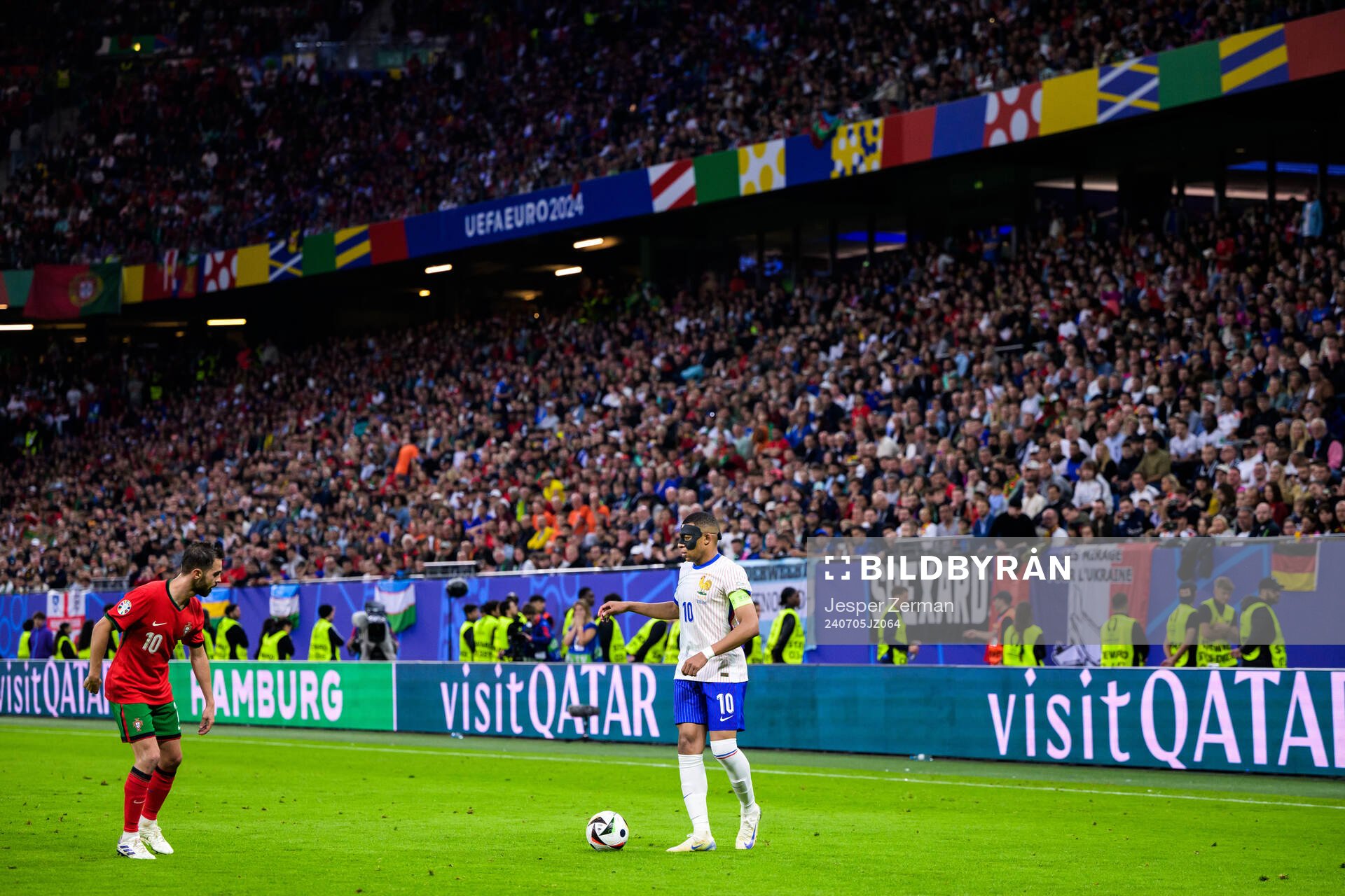 Bernardo Silva of Portugal and Kylian Mbappé of France
