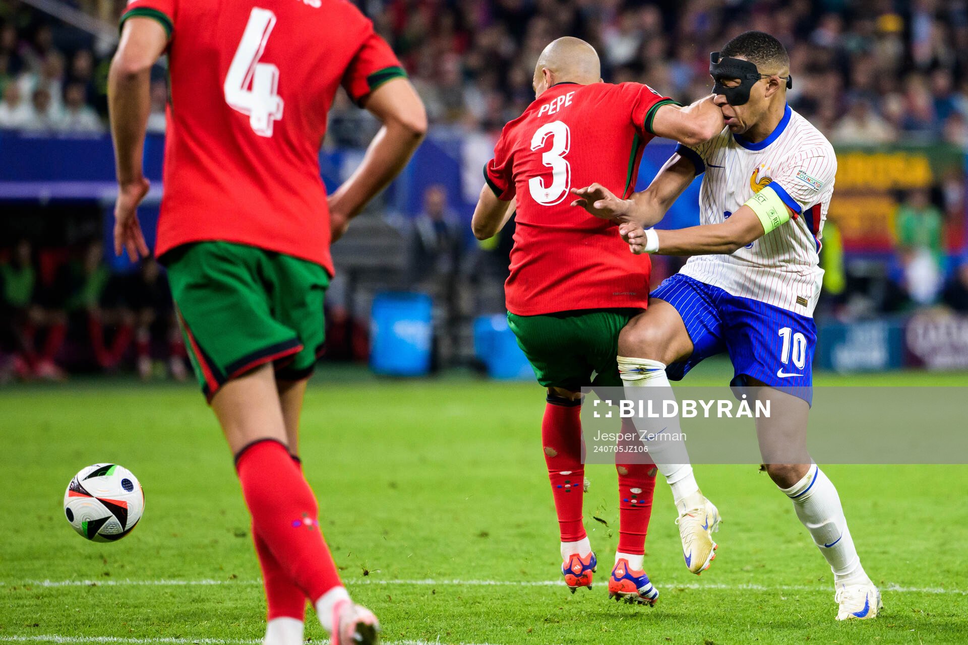 Pepe of Portugal and Kylian Mbappé of France