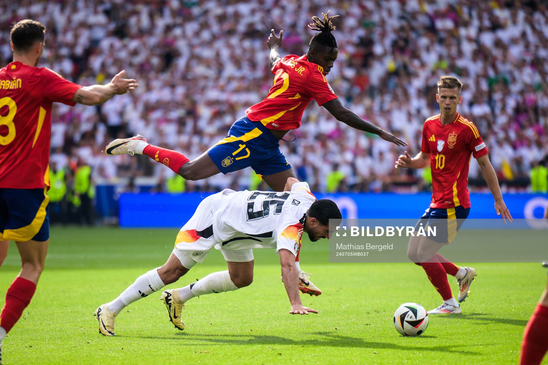 Nicholas Williams of Spain and Emre Can of Germany