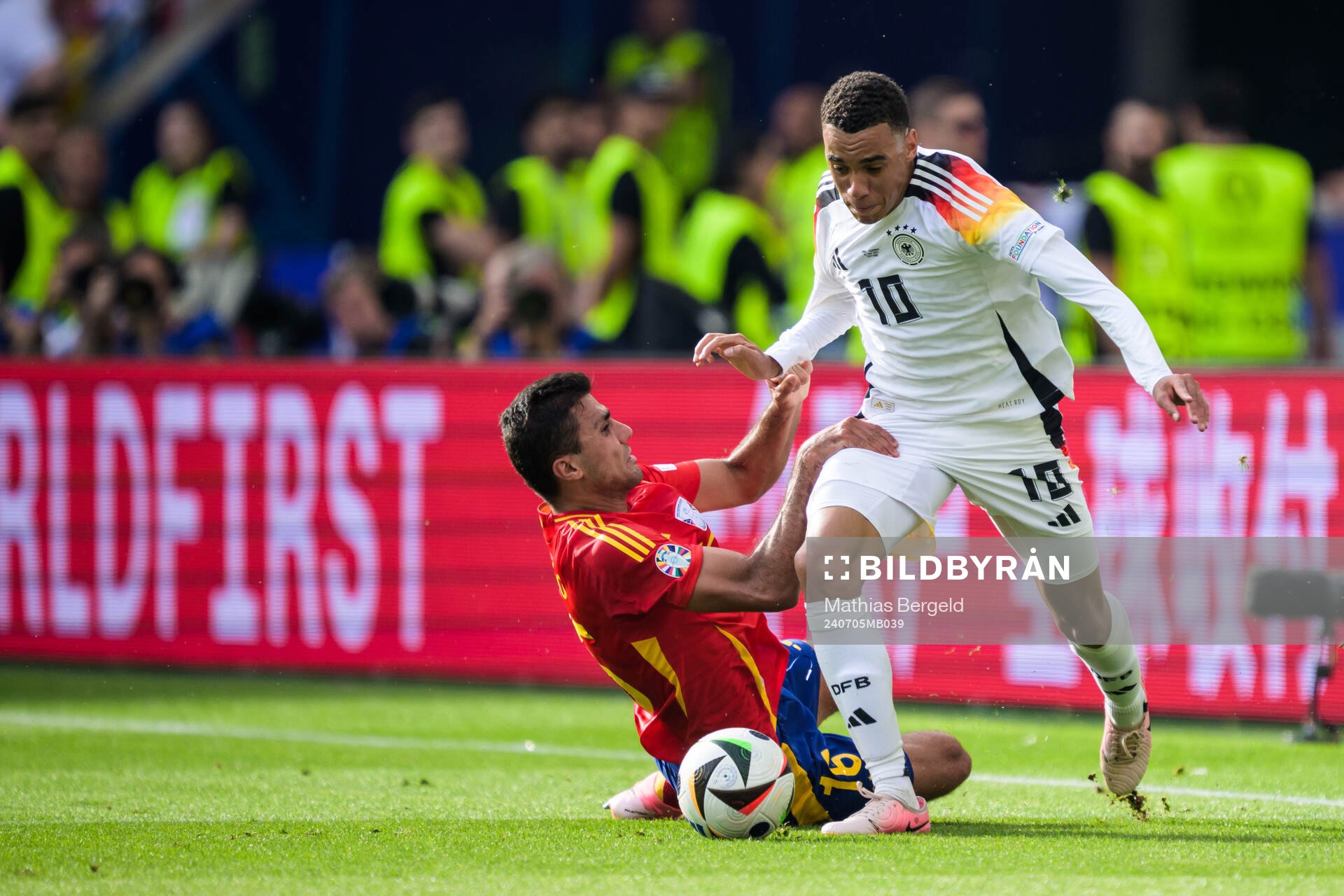 Rodrigo Hernandez of Spain and Jamal Musiala of Germany