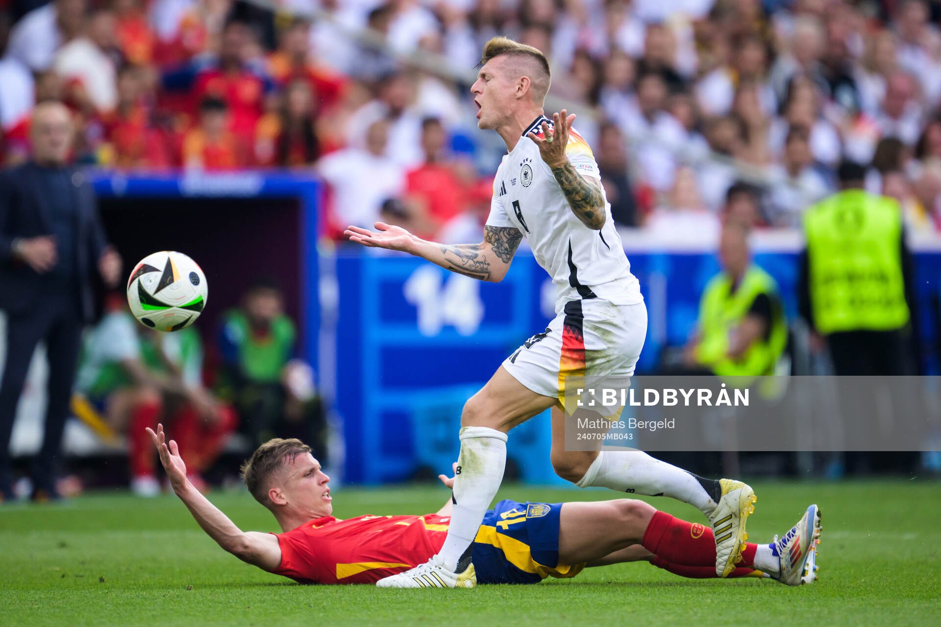 Toni Kroos of Germany and Daniel Olmo of Spain