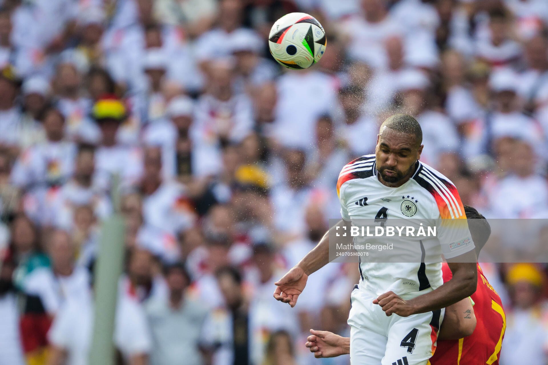 Jonathan Tah of Germany and Alvaro Morata of Spain