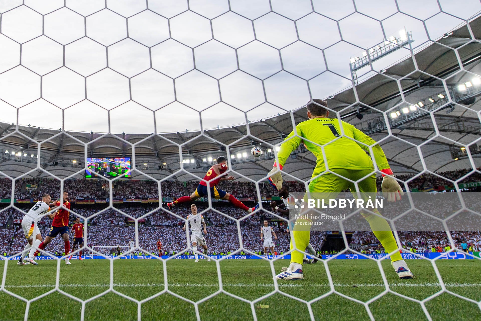 Mikel Merino of Spain scores 2-1 behind goalkeeper Manuel