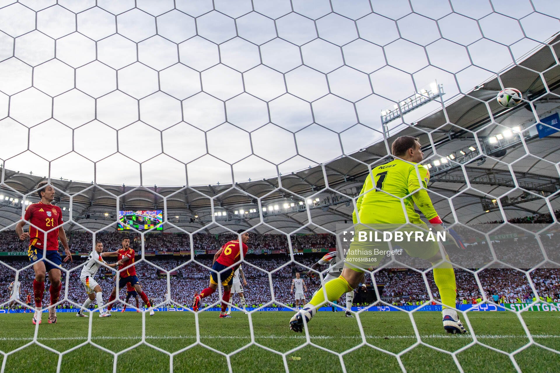 Mikel Merino of Spain scores 2-1 behind goalkeeper Manuel