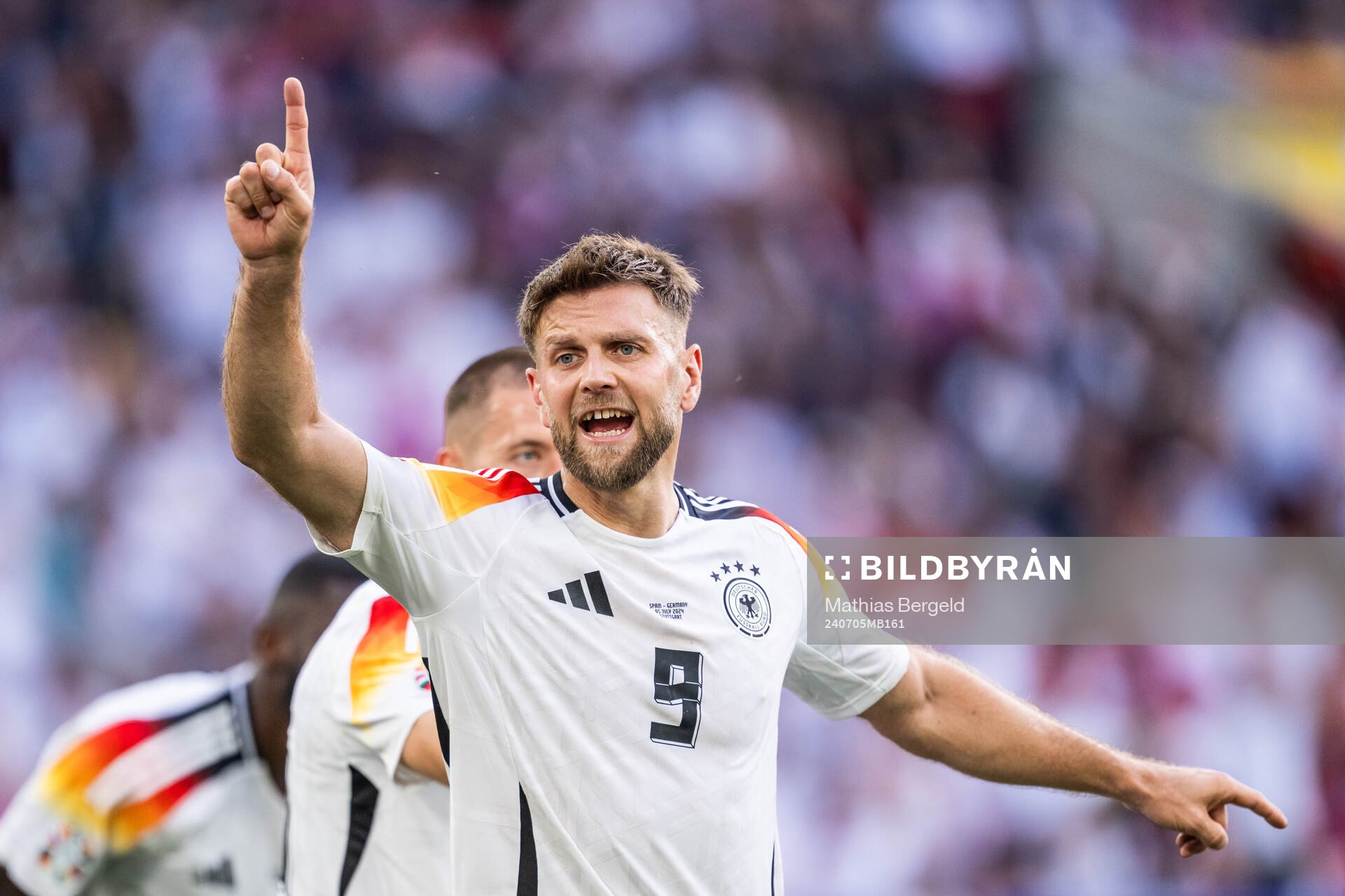 Niclas Füllkrug of Germany reacts