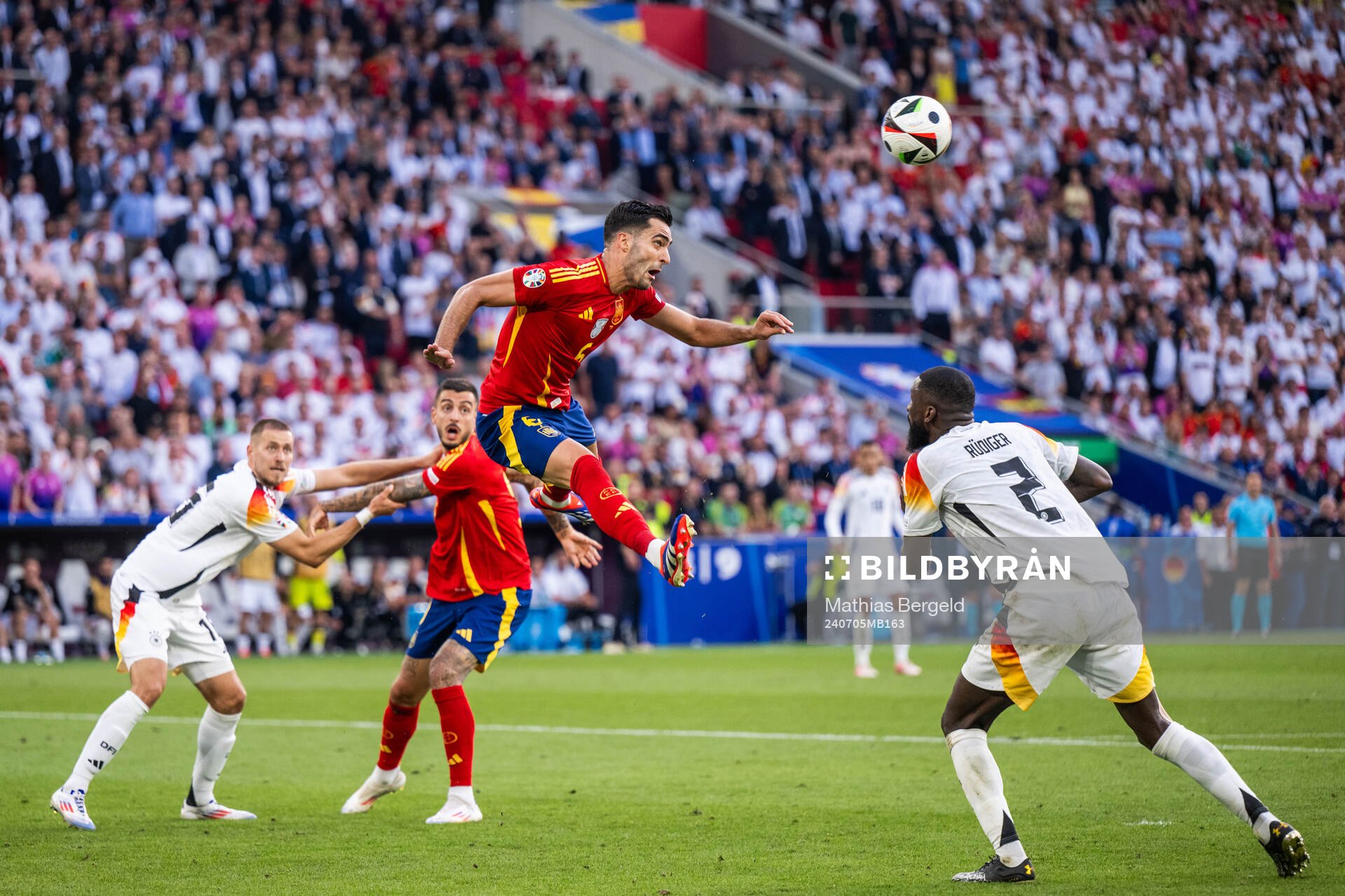 Antonio Rüdiger of Germany sees Mikel Merino of Spain