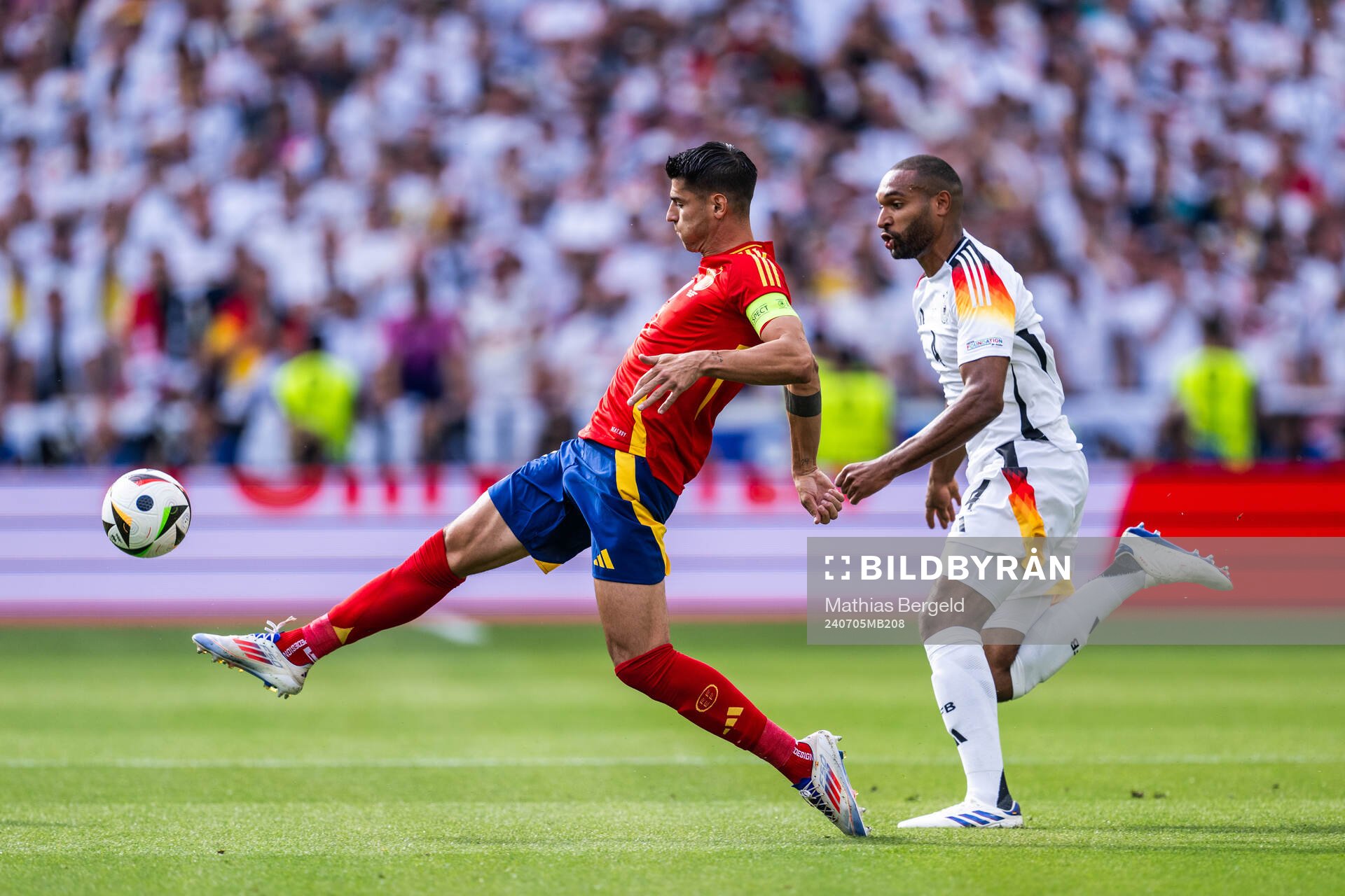 Alvaro Morata of Spain and Jonathan Tah of Germany
