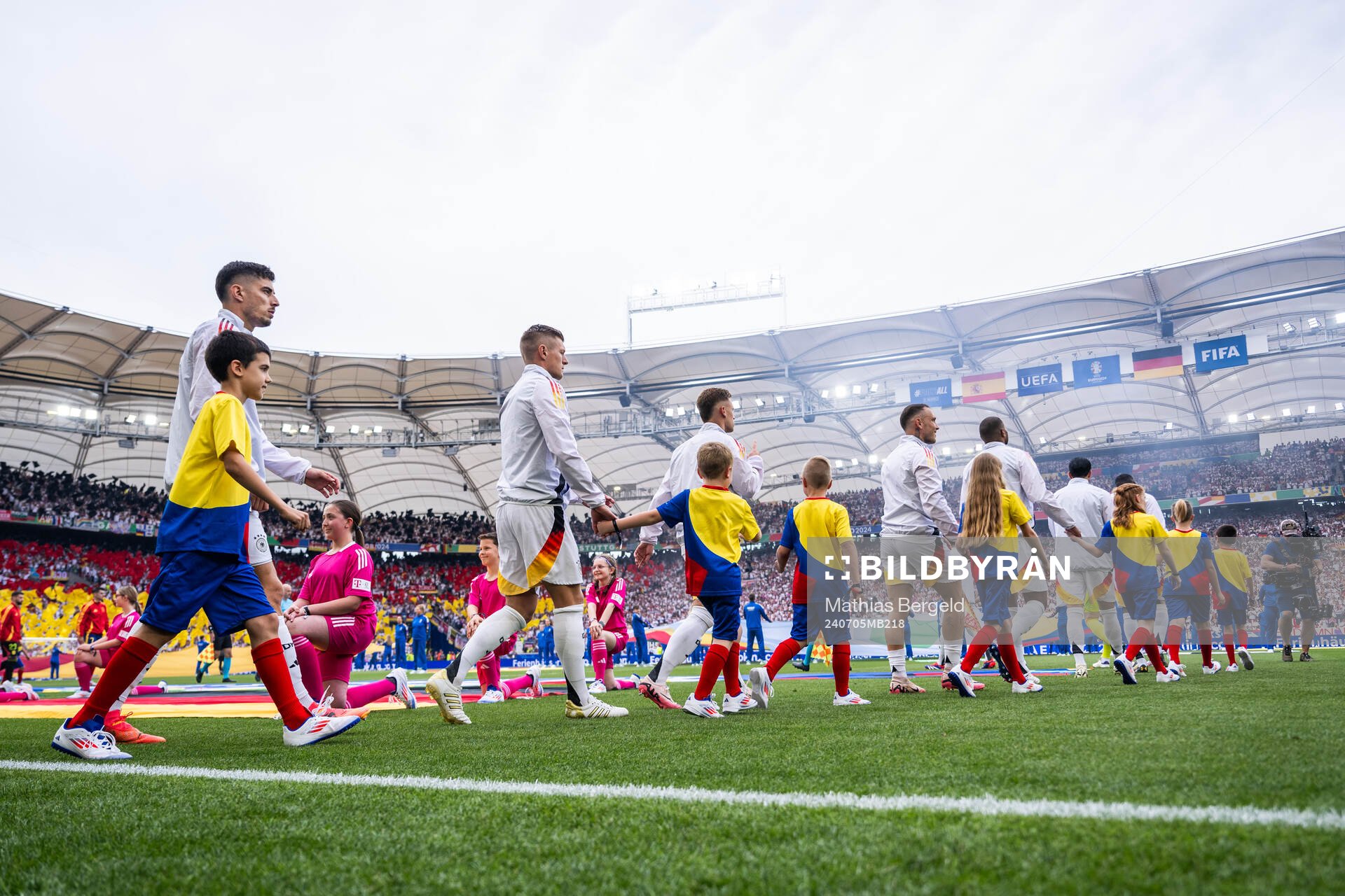 Kai Havertz and Toni Kroos of Germany enter the pitch