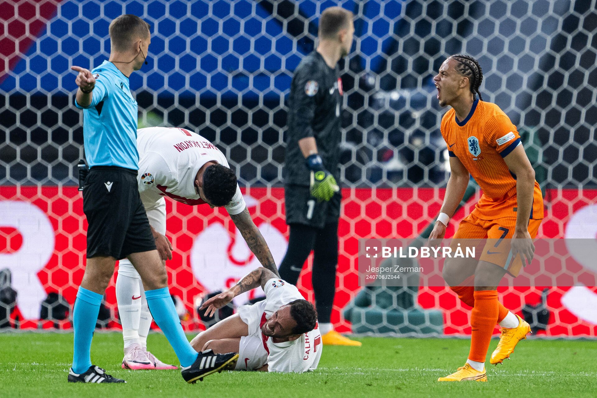 Xavi Simons of Netherlands and Hakan Calhanoglu of Turkey during the UEFA Euro 2024 Football Championship quarterfinal between Netherlands and Turkey on July 6, 2024 in Berlin.
