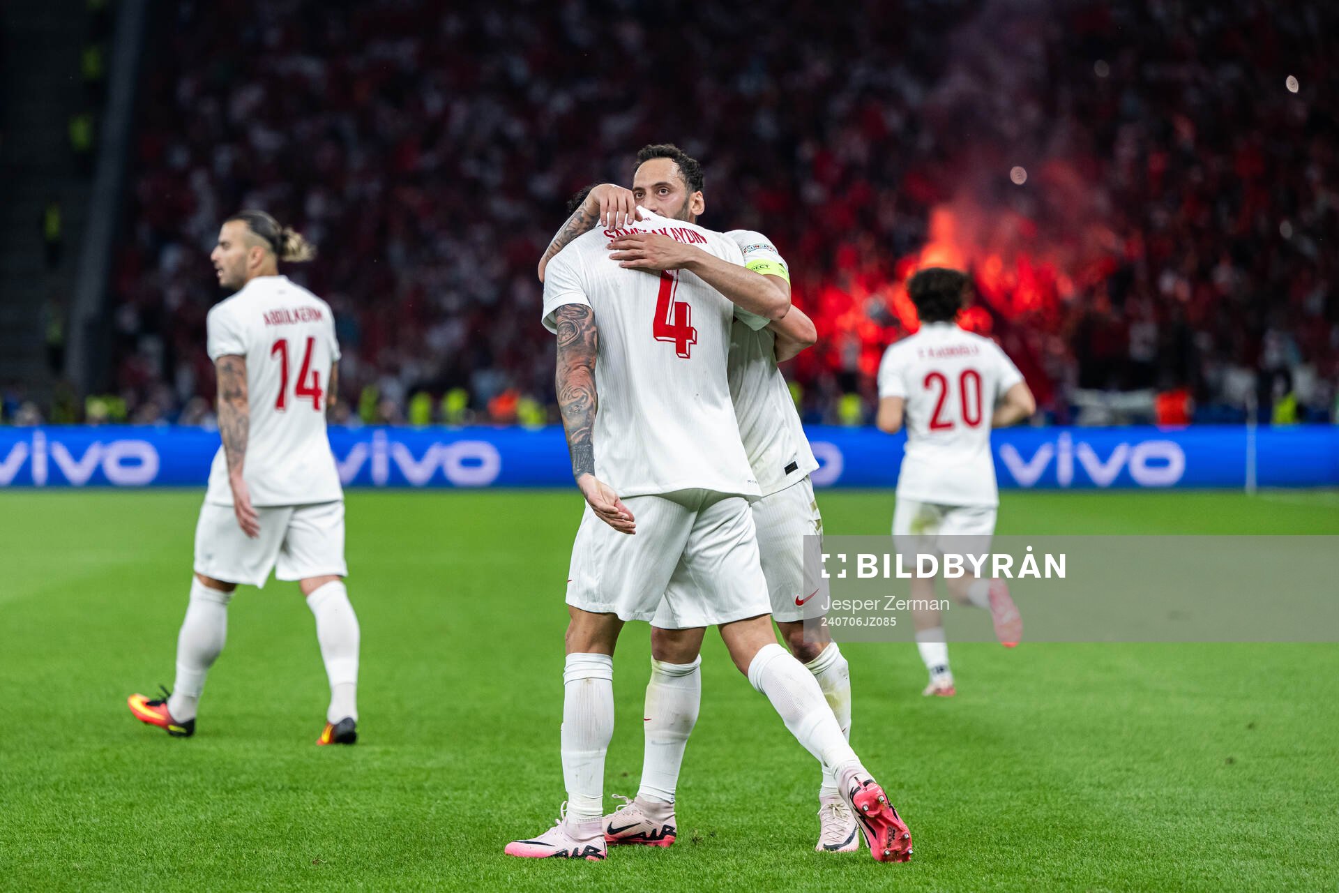Samet Akaydin and Hakan Calhanoglu of Turkey celebrate