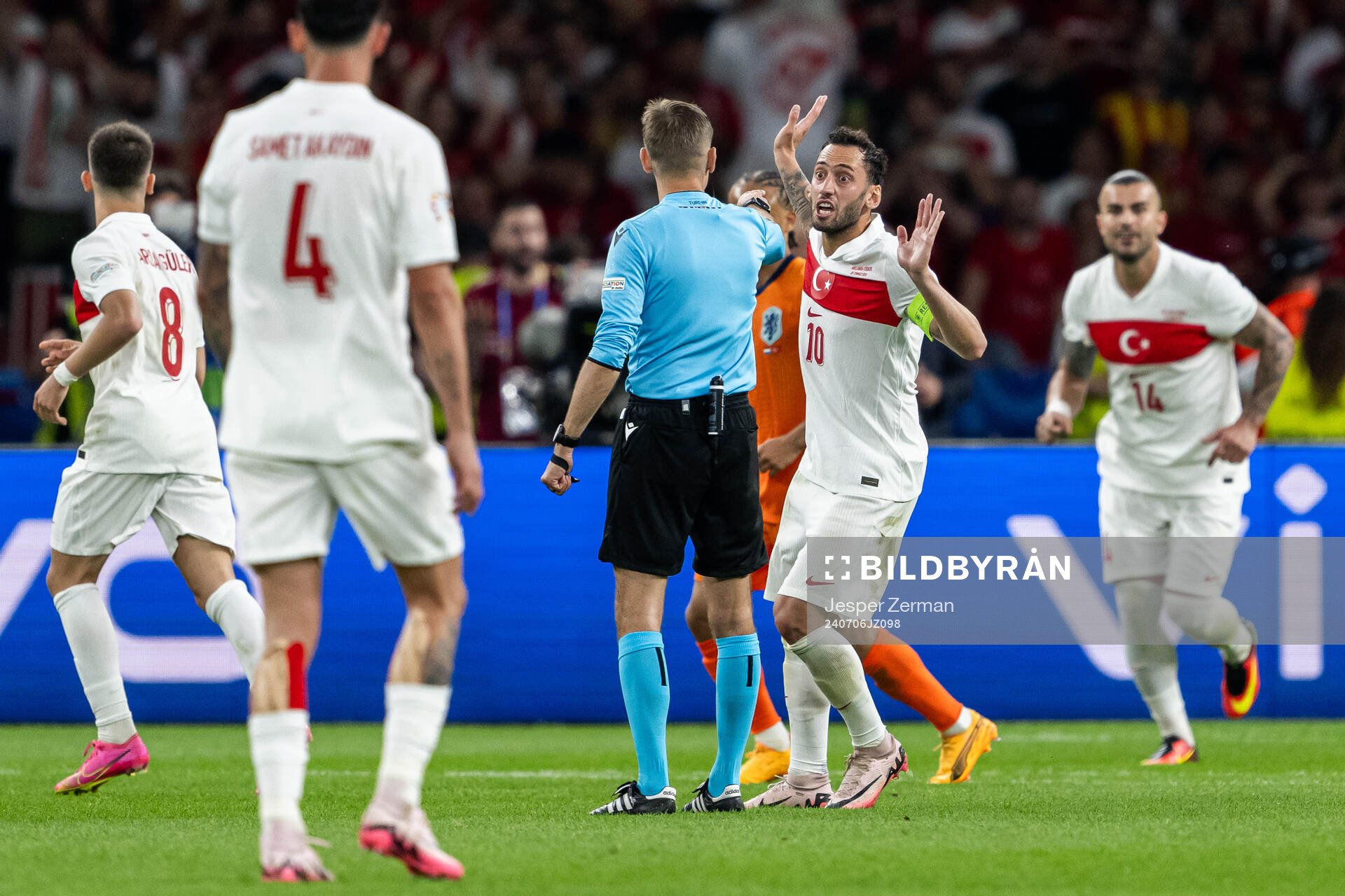 Hakan Calhanoglu of Turkey reacts