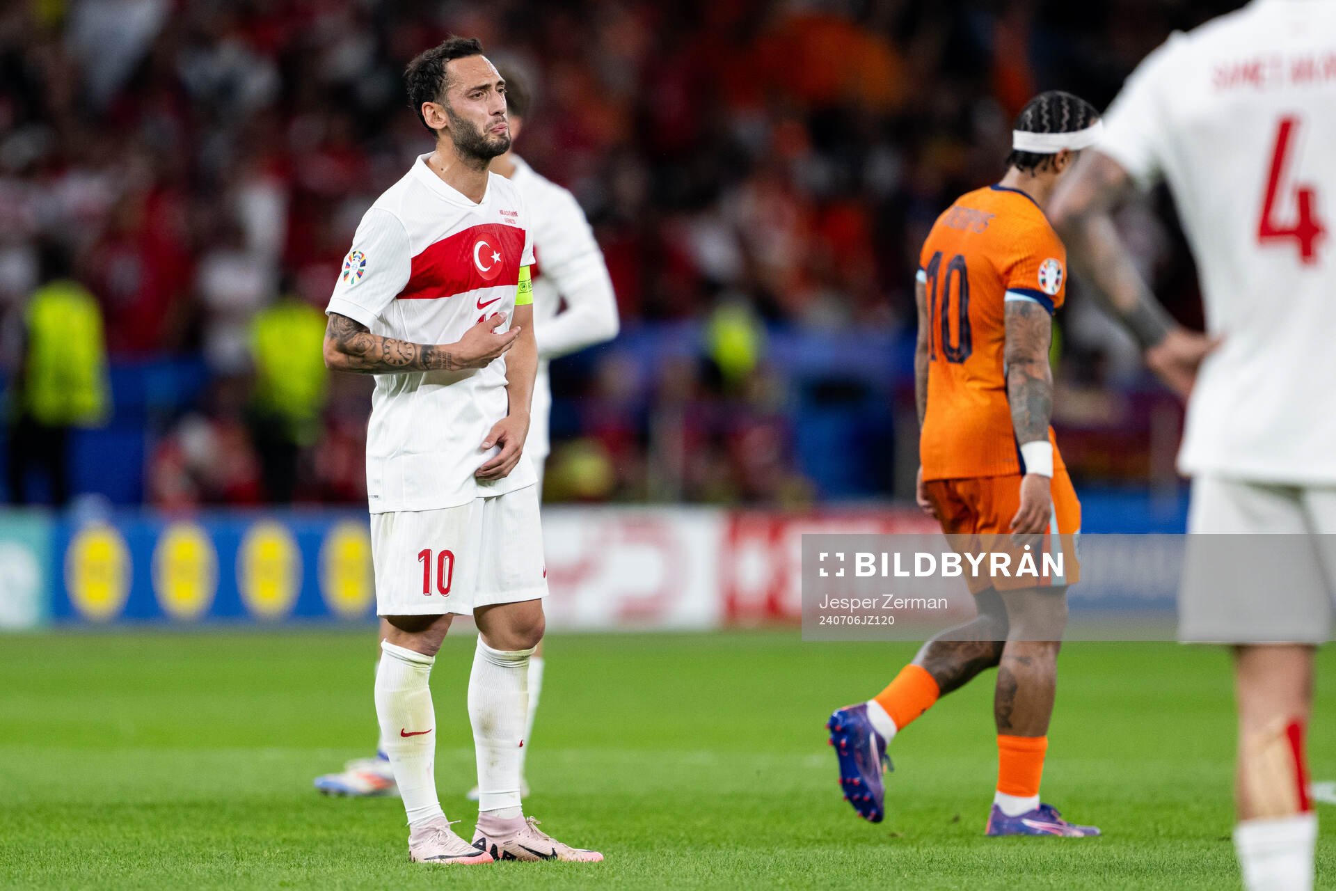 Hakan Calhanoglu of Turkey looks dejected