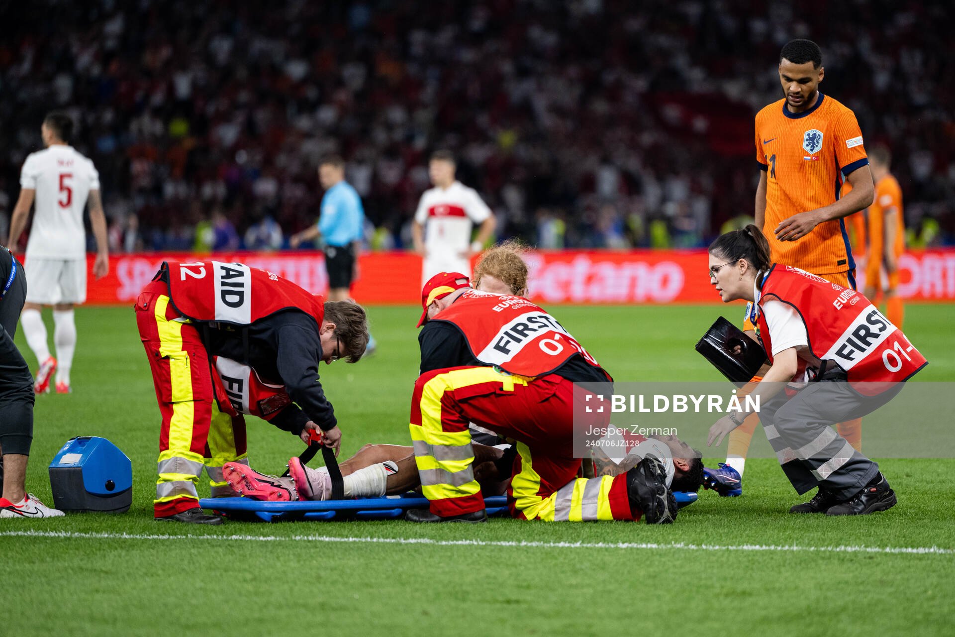 Samet Akaydin of Turkey is carried off the field