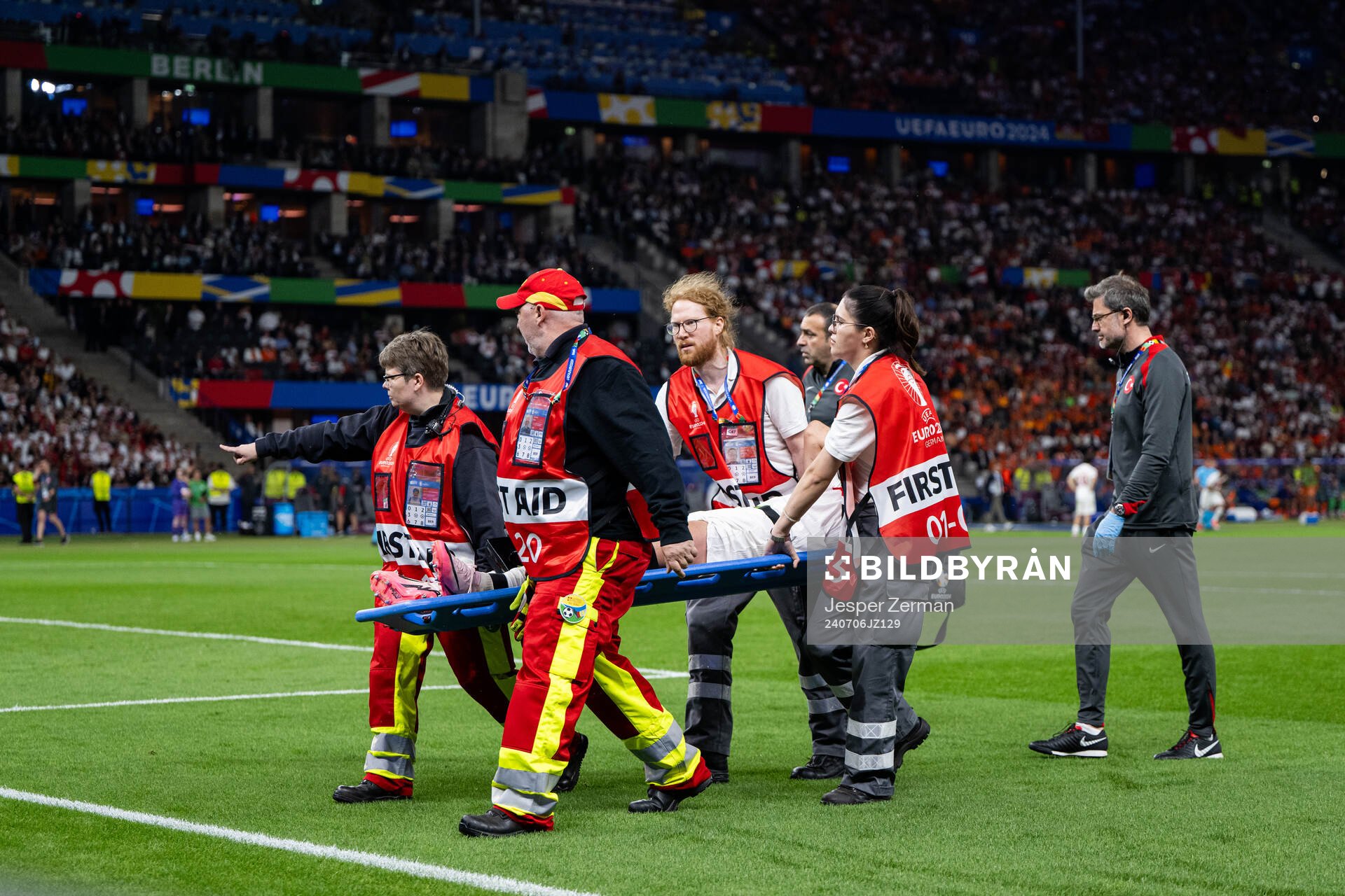 Samet Akaydin of Turkey is carried off the field