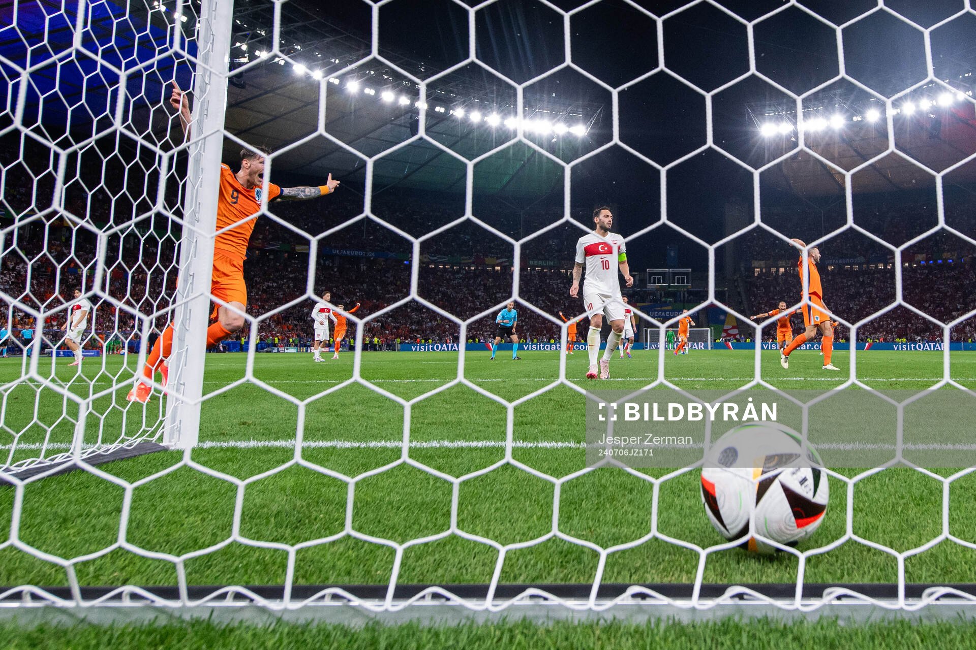 Wout Weghorst of Netherlands and Hakan Calhanoglu of Turkey