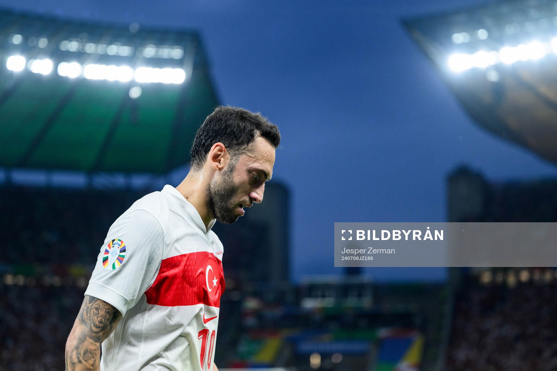 Hakan Calhanoglu of Turkey looks dejected