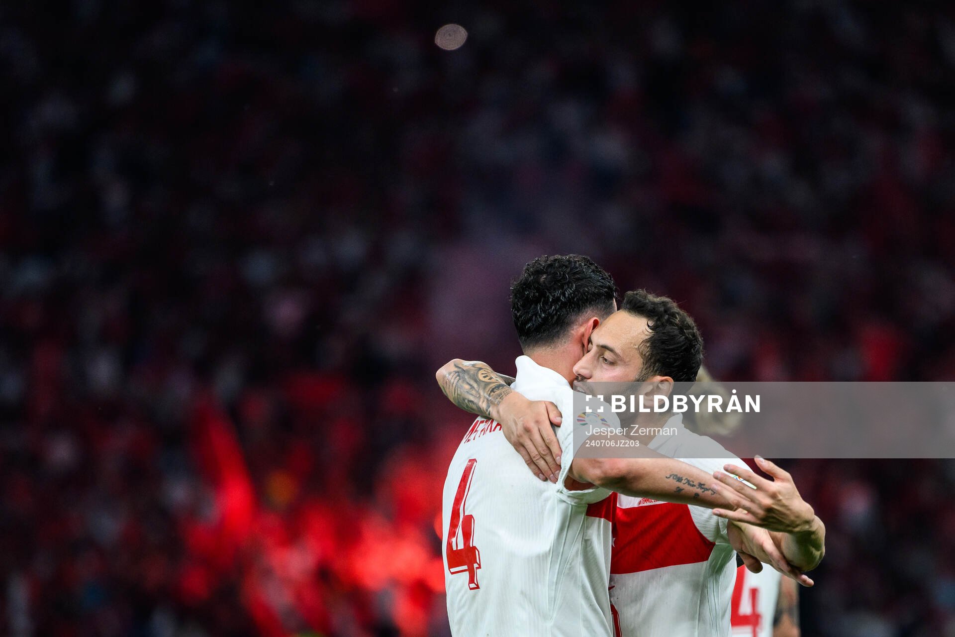 Samet Akaydin and Hakan Calhanoglu of Turkey celebrates