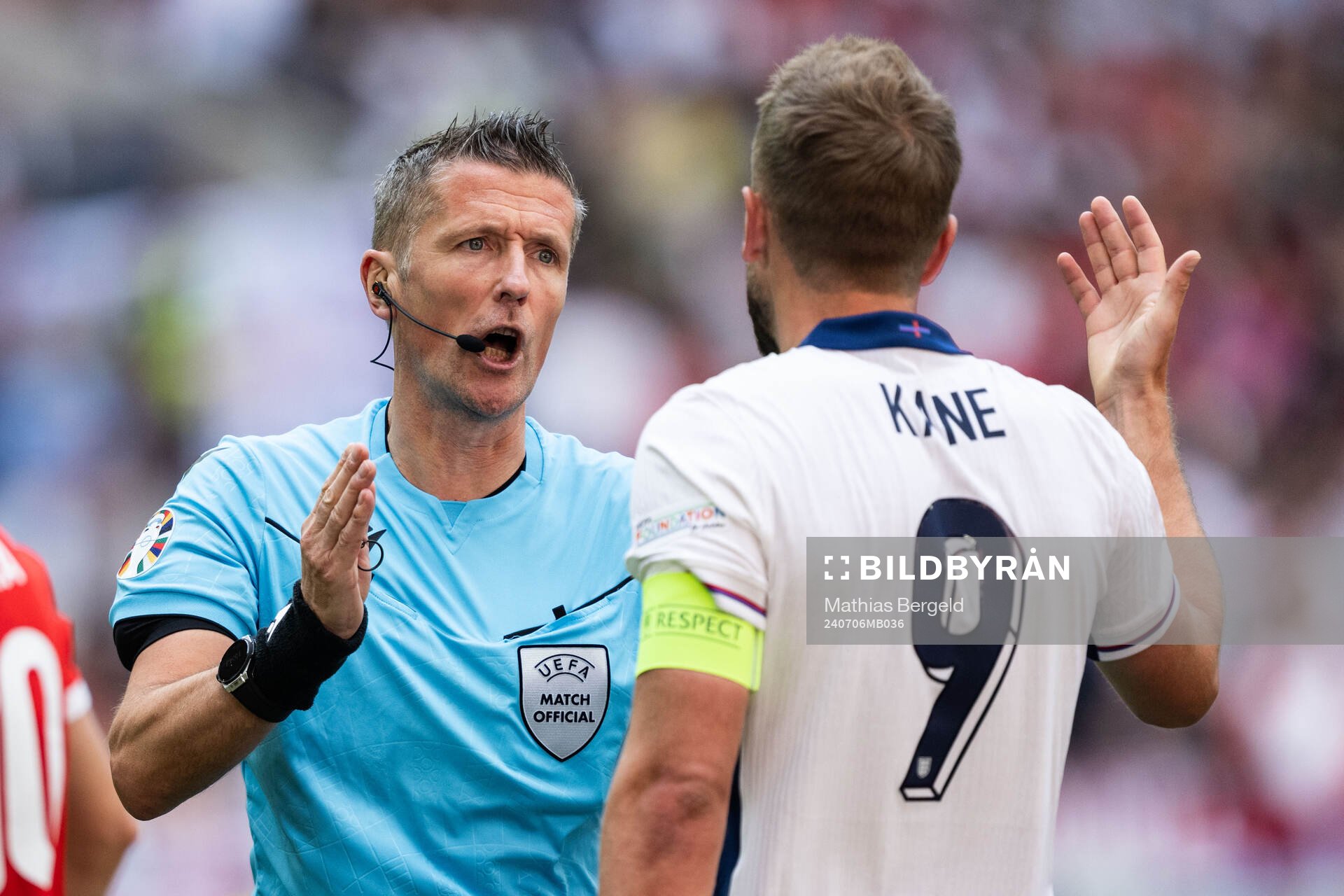 Referee Daniele Orsato with Harry Kane of England during the UEFA Euro 2024 Football Championship quarterfinal between England and Switzerland on July 6, 2024 in Düsseldorf.