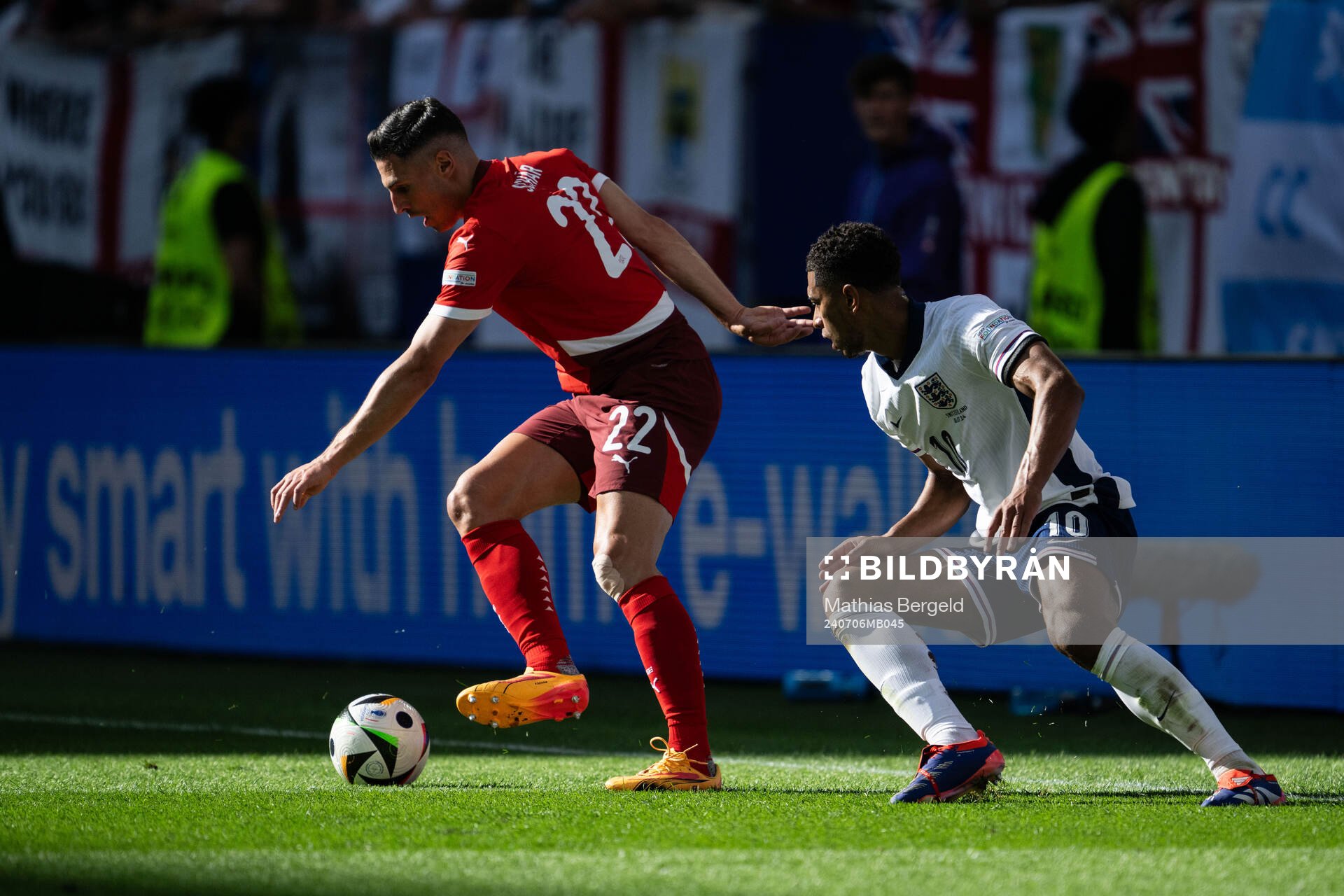 Fabian Schär of Switzerland and Jude Bellingham of England