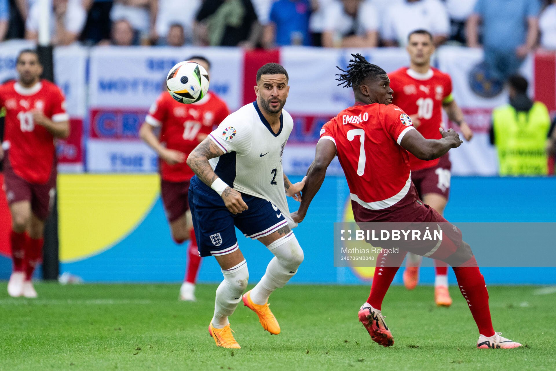 Kyle Walker of England and Breel Embolo of Switzerland